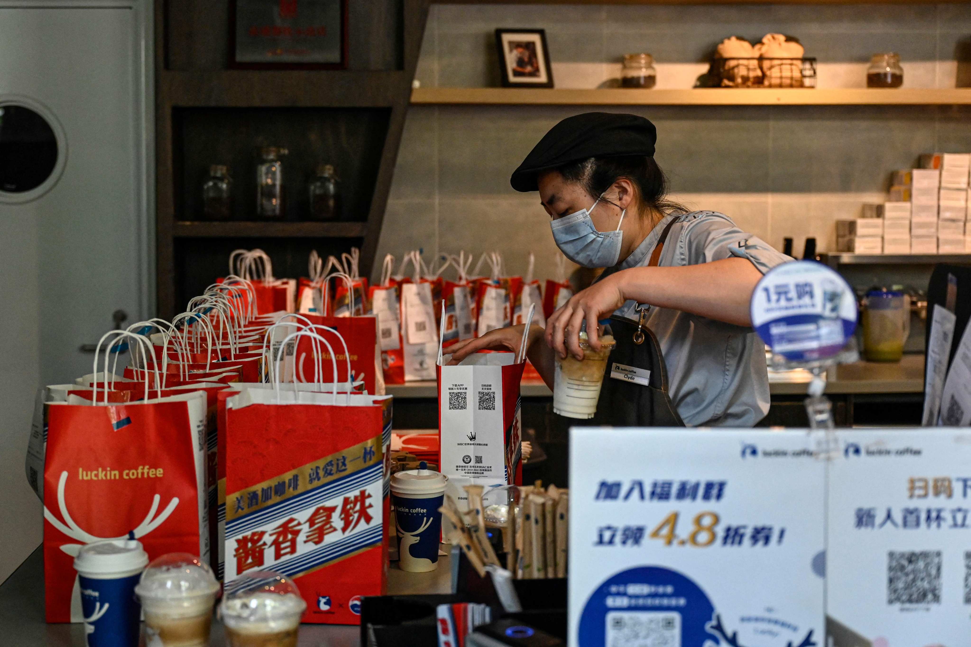 A Luckin Coffee employee at a shop in Beijing. Photo: AFP