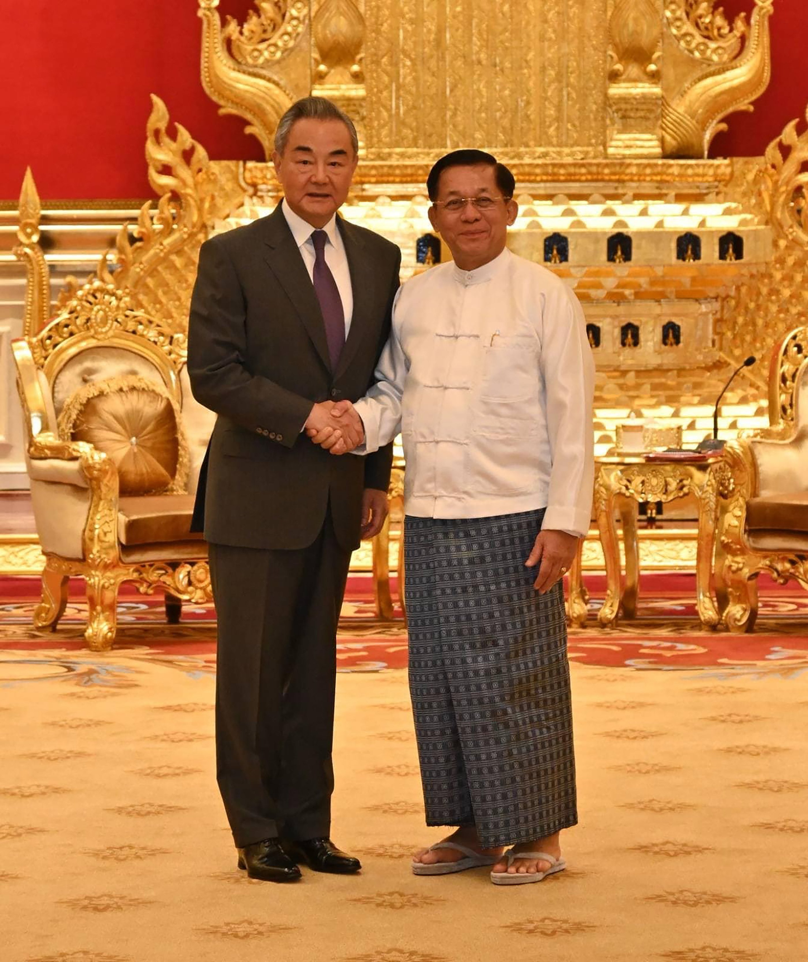 Myanmar junta chief Min Aung Hlaing (right) shakes hands with Chinese Foreign Minister Wang Yi during a meeting in Naypyitaw last month. Photo: EPA-EFE/Myanmar military information team