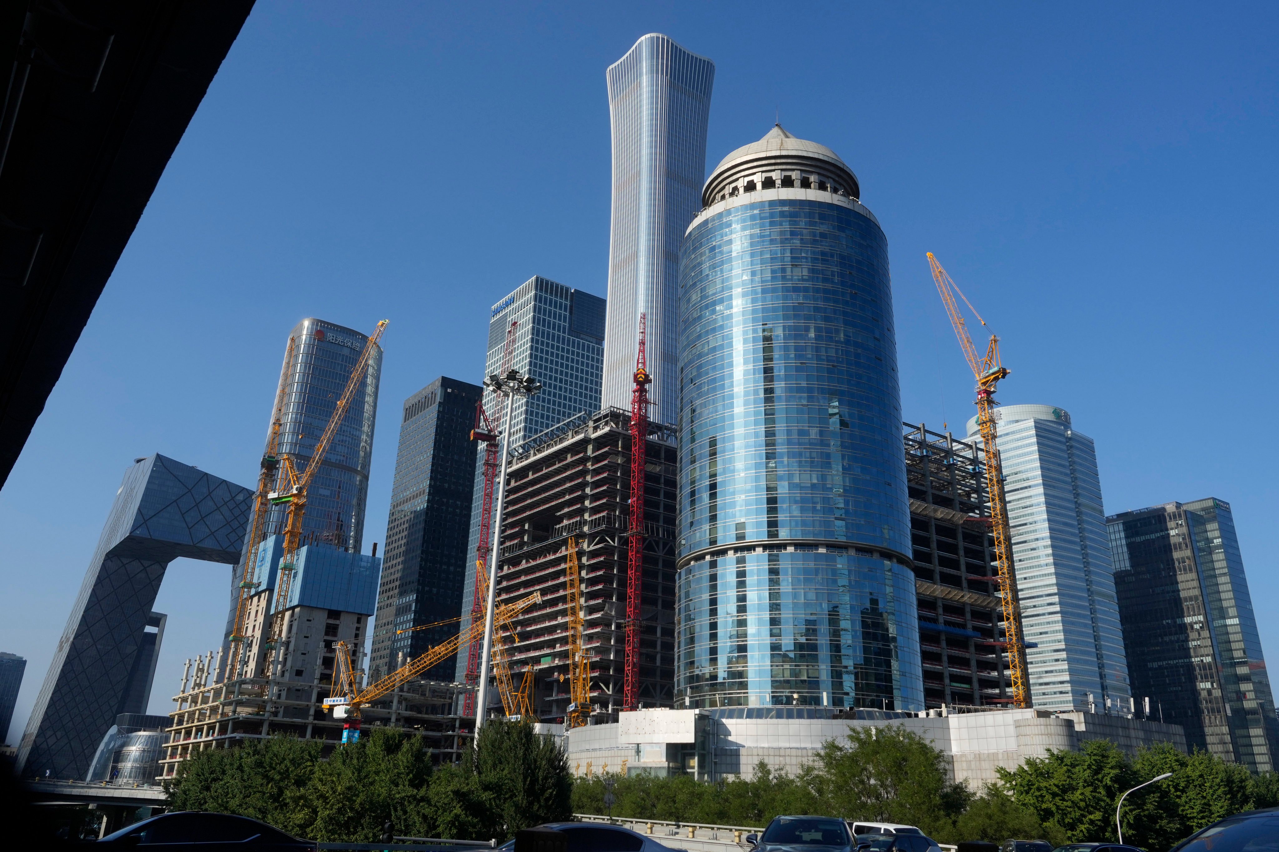 Construction cranes are seen near the central business district of Beijing on August 8, 2024. Photo: AP