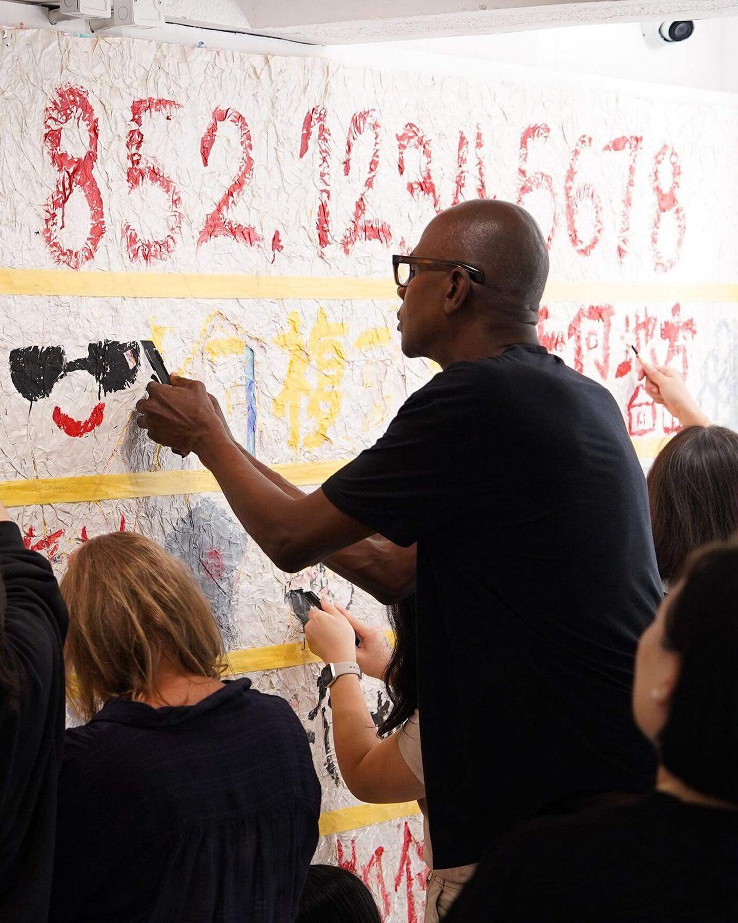 Mark Bradford works with young people in Sham Shui Po to create a mural at The Bridge+. Photo: Instagram/@hauserwirth