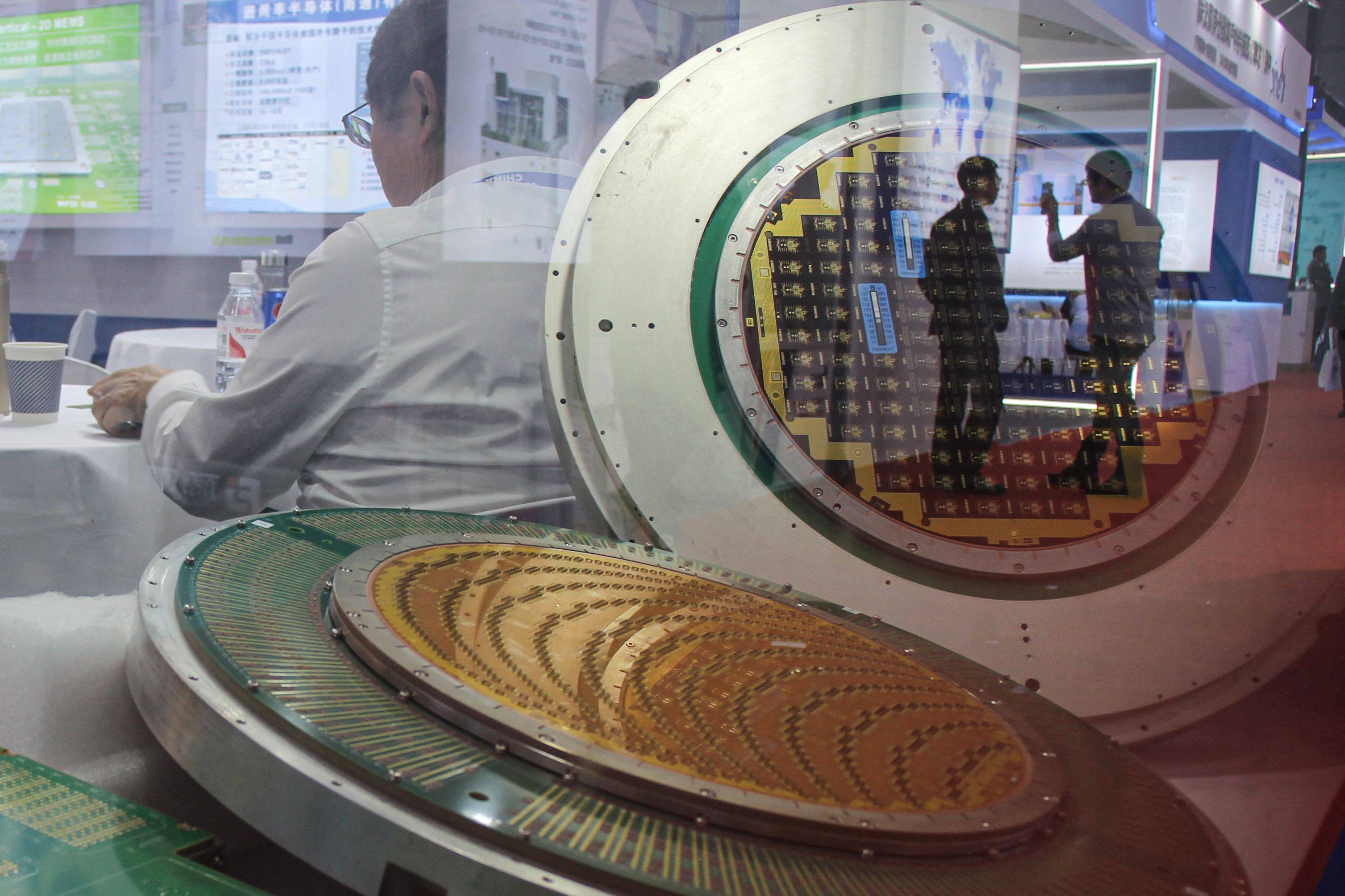 Silicon wafers are displayed during the SEMICON China exhibition in Shanghai, March 2024. Photo: AFP