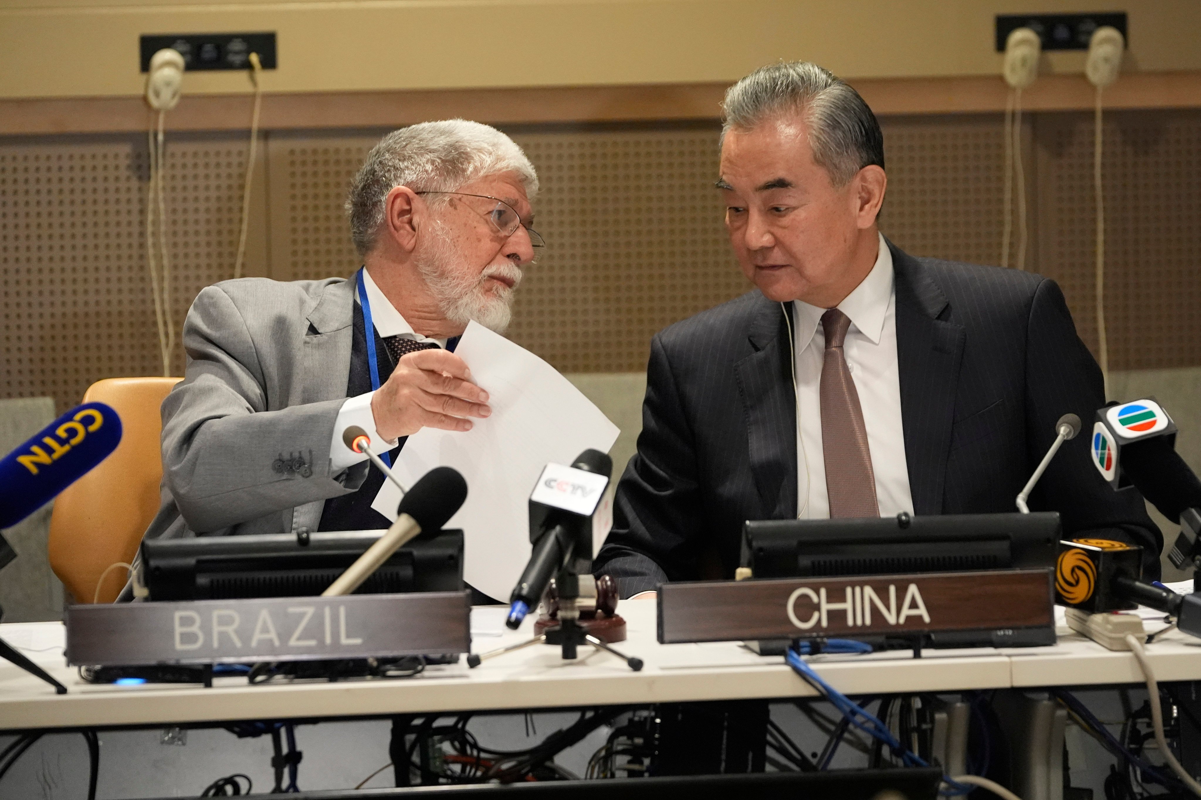 Wang Yi (right), China’s top diplomat, confers with senior Brazilian official Celso Amorim at a meeting in New York on Friday. Photo: AP