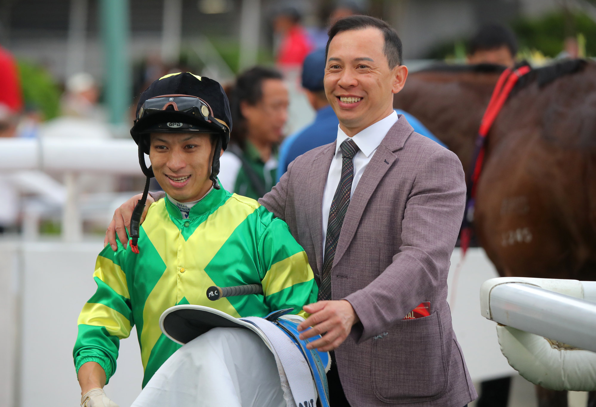 Jockey Matthew Chadwick and trainer Cody Mo celebrate Pray For Mir’s victory.