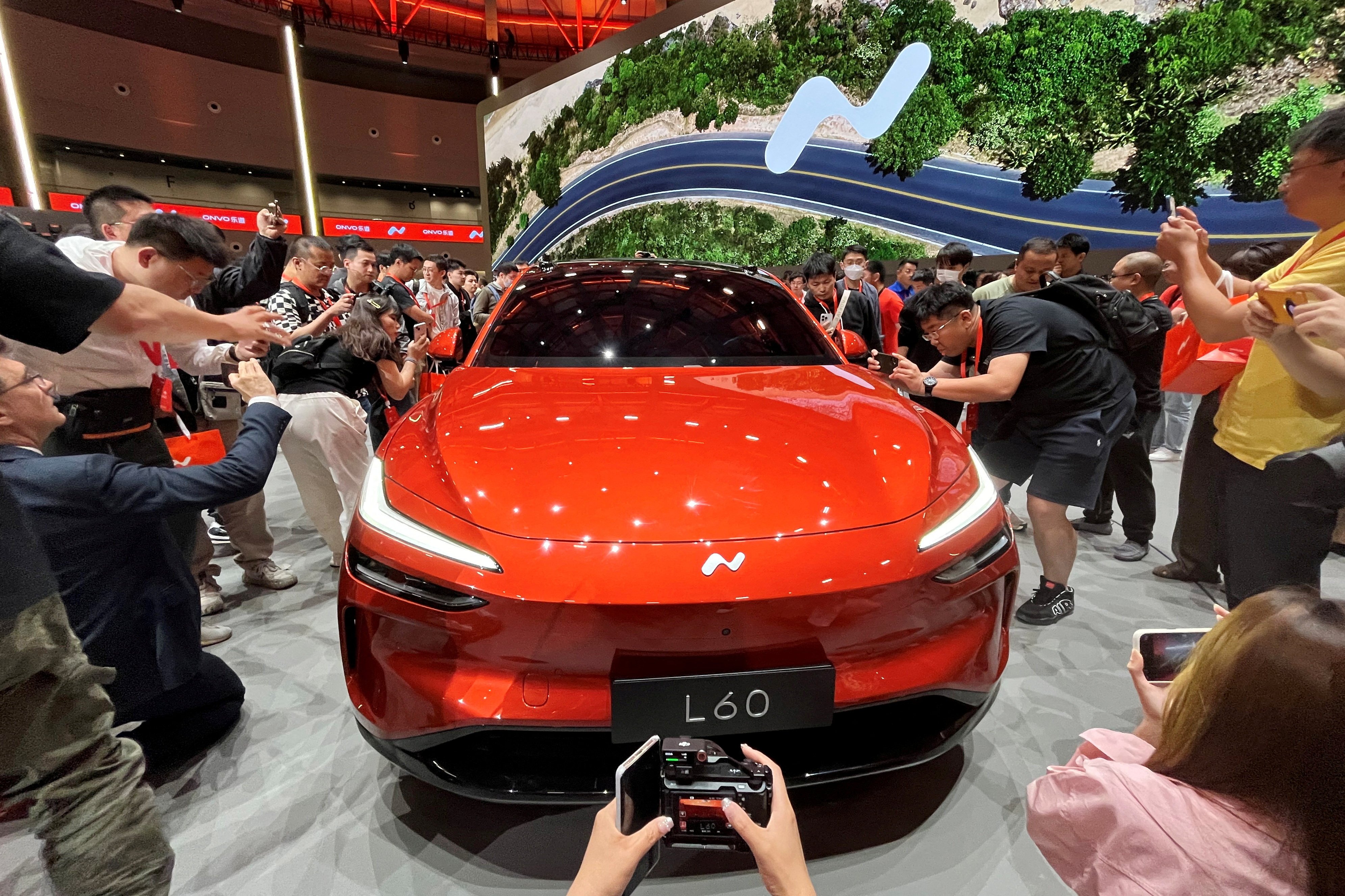 People look at the newly unveiled Onvo L60 SUV, the first vehicle of Chinese electric vehicle maker Nio’s new lower-priced brand, in Shanghai on May 15, 2024. Photo: Reuters