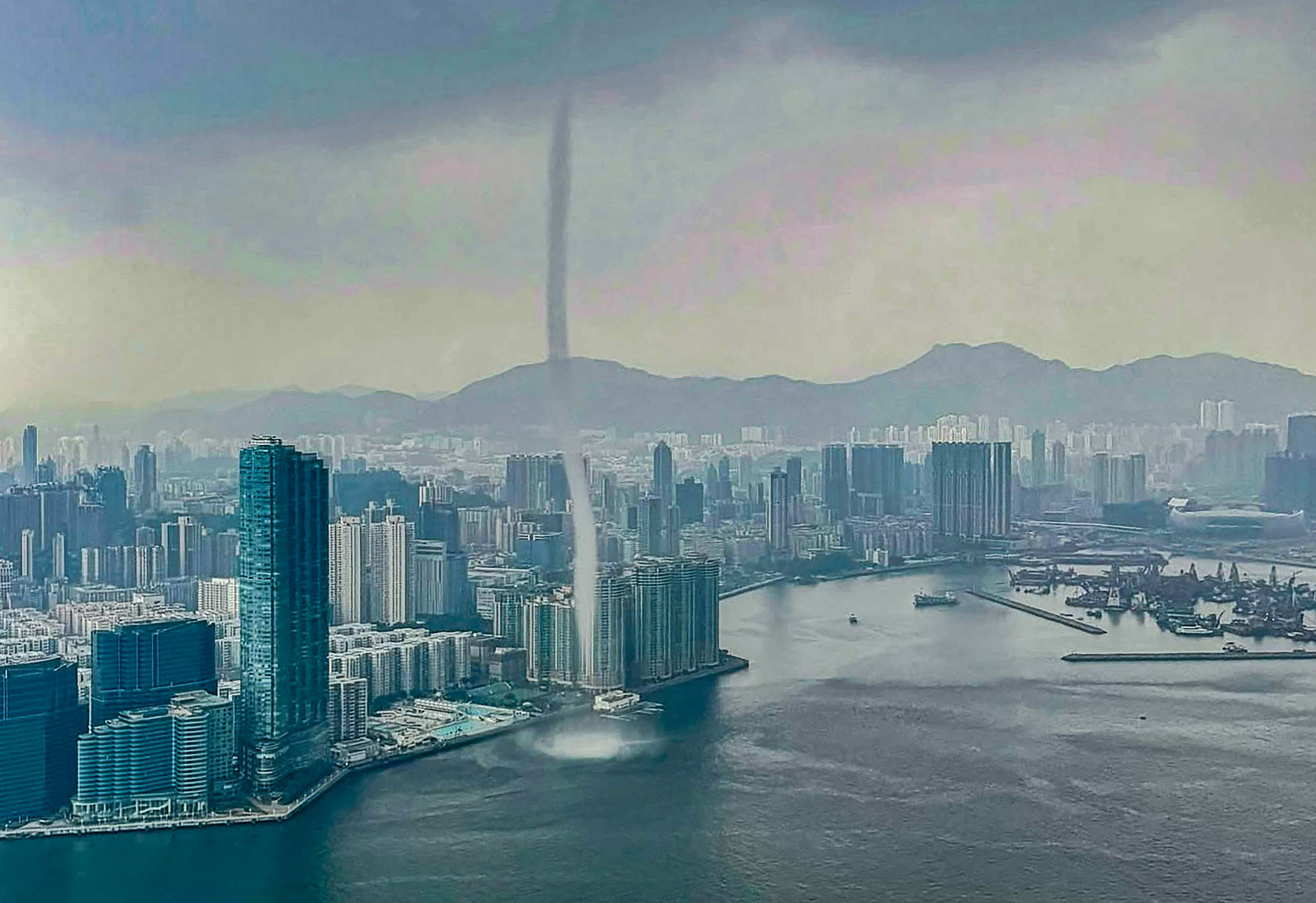 The waterspout formed in the sea off Hung Hom and dissipated shortly after hitting a wall. Photo: Government Flying Service