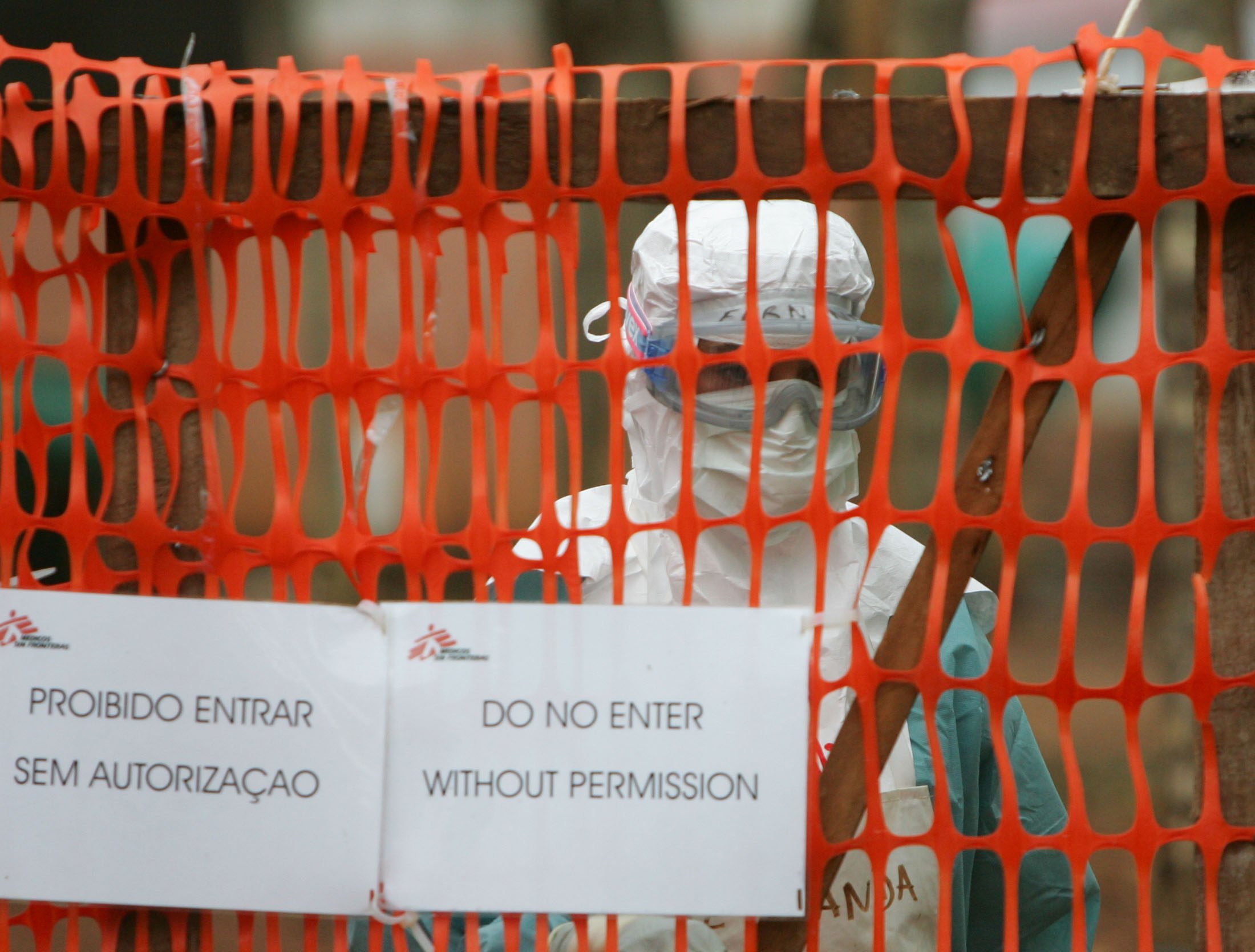 A health worker in protective clothing peers out from behind barriers marking an isolation ward for victims of the deadly Marburg virus. File photo: Reuters