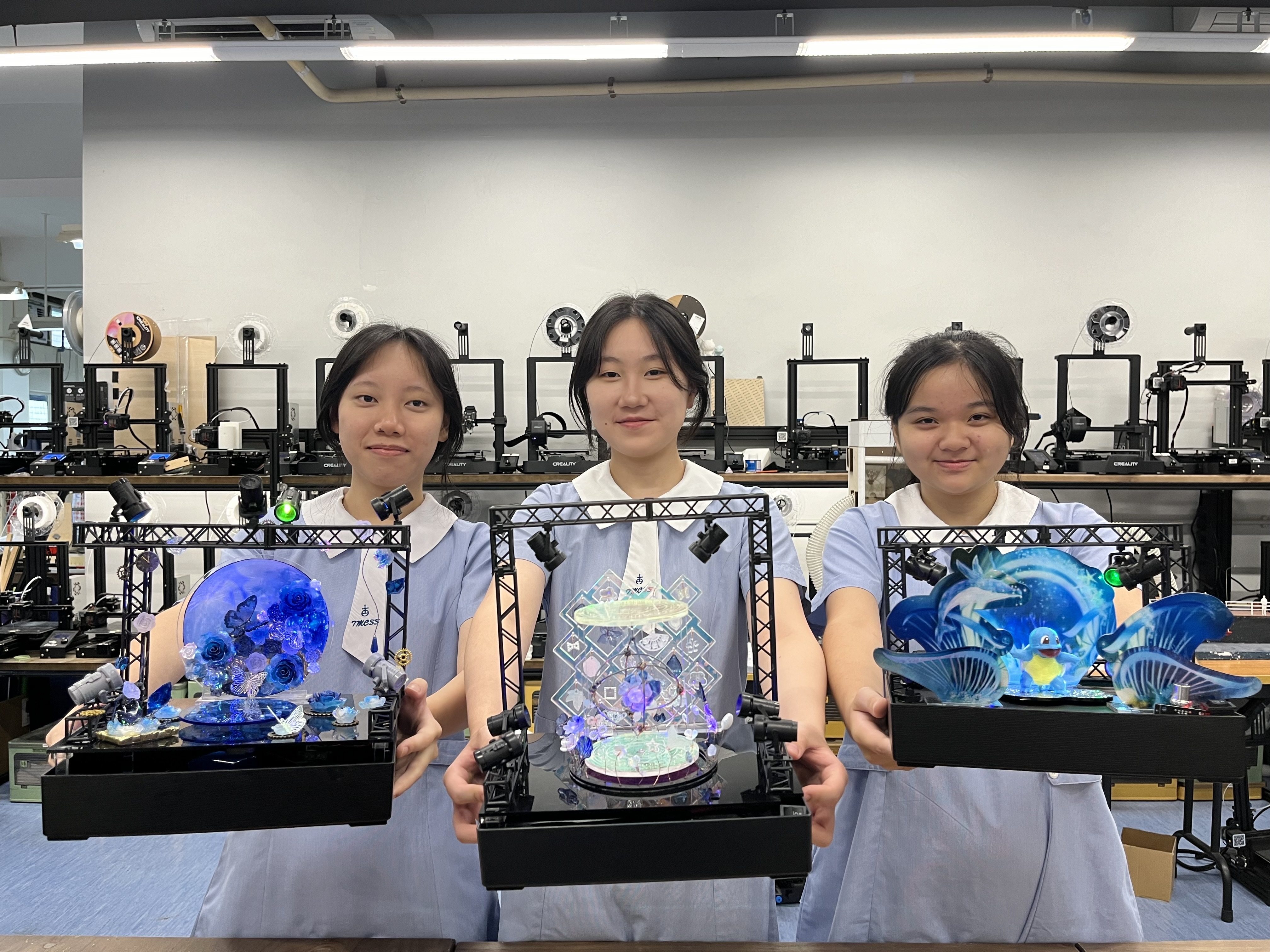 Crystal Yeung (from left), Annie Xia and Moon Kong hold the miniature stages they designed. Photo: Handout