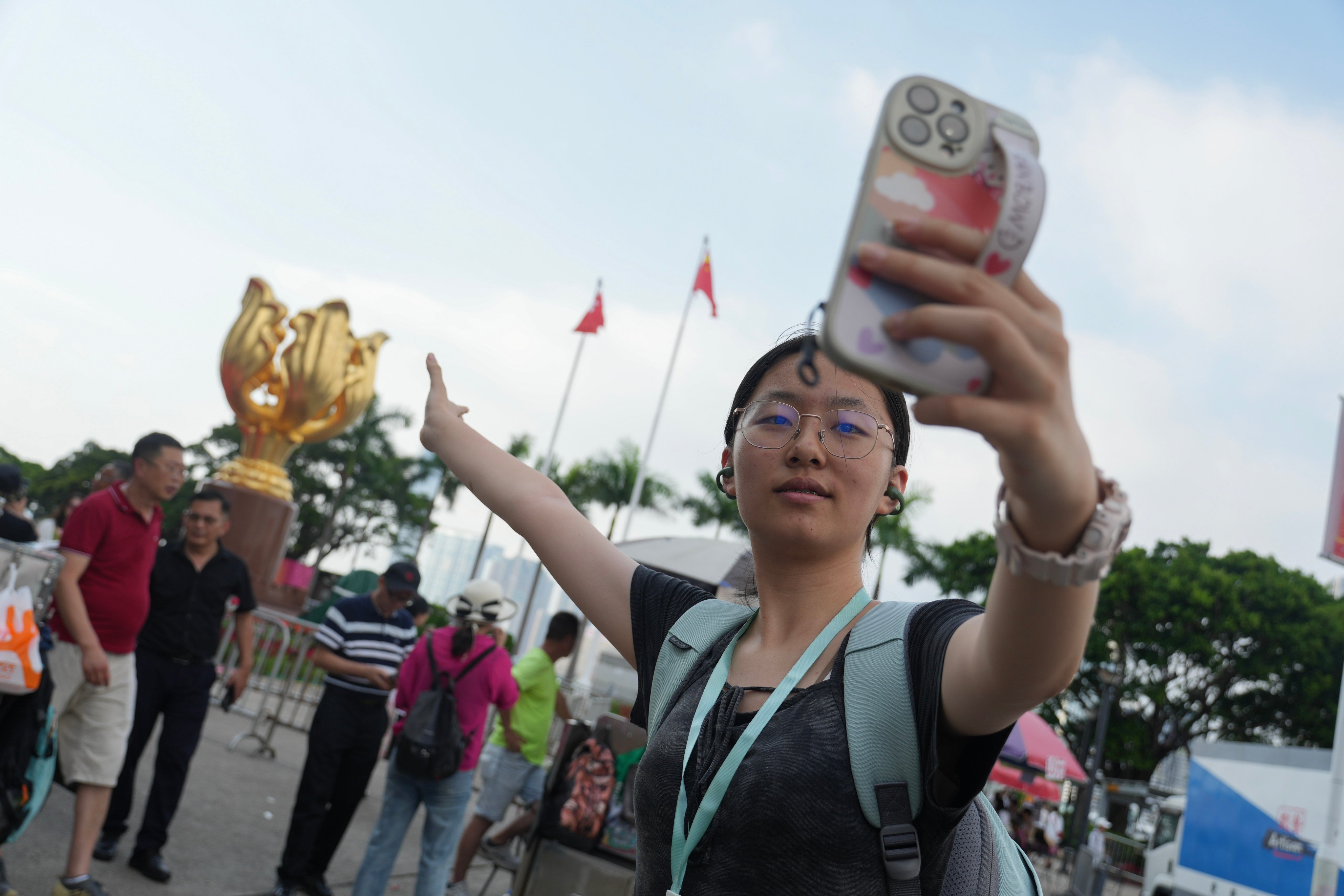 Tourists visit Golden Bauhinia Square in Wan Chai. Photo: Sam Tsang