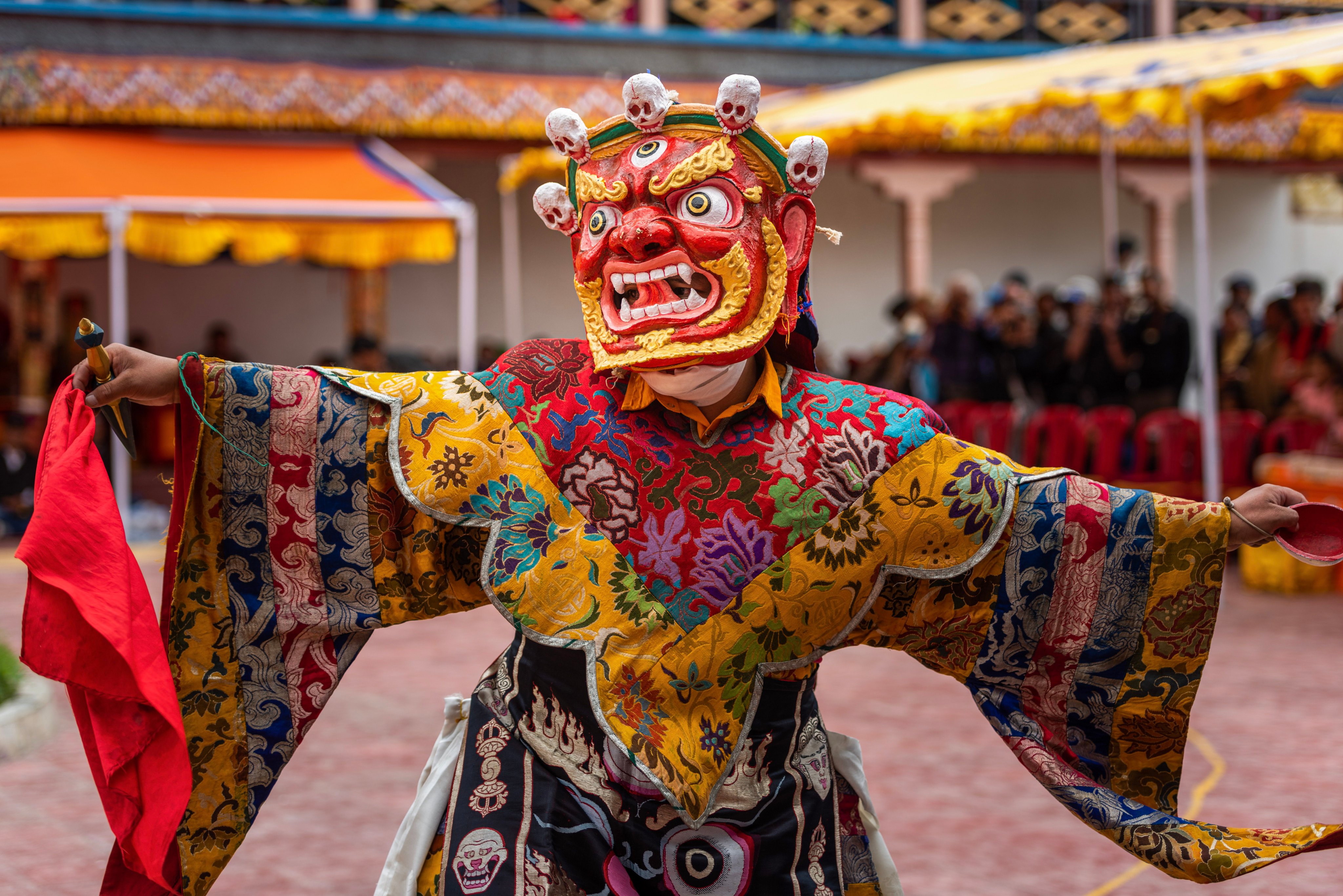 A monk in colourful attire dances at the Takthok festival. Photo: Shutterstock