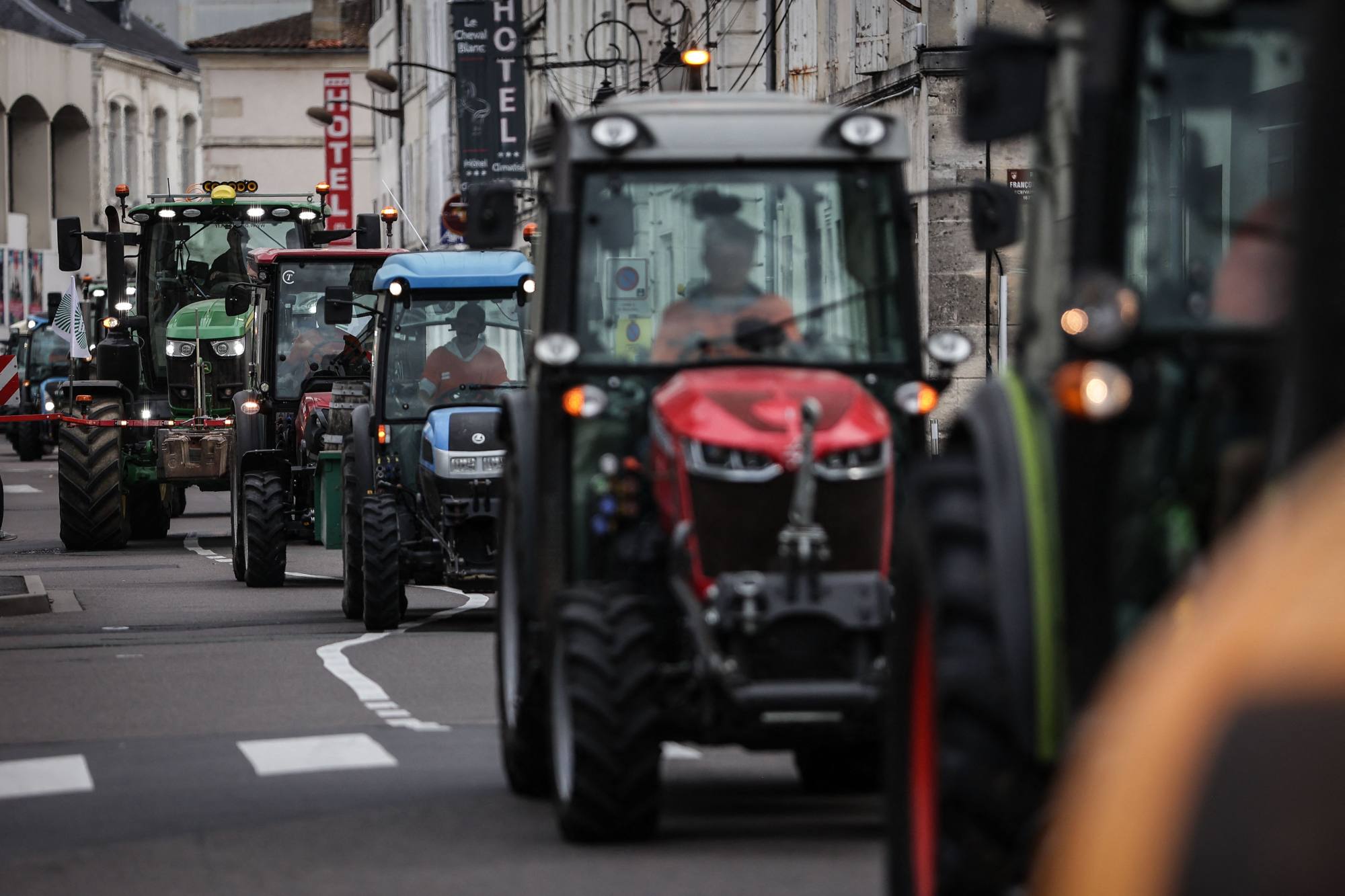 Cognac winegrowers drive tractors during a protest in the French town of Cognac in September. Cognac producers fear Beijing will impose duties on European brandy should the EU pass its planned tariffs on Chinese EVs. Photo: AFP