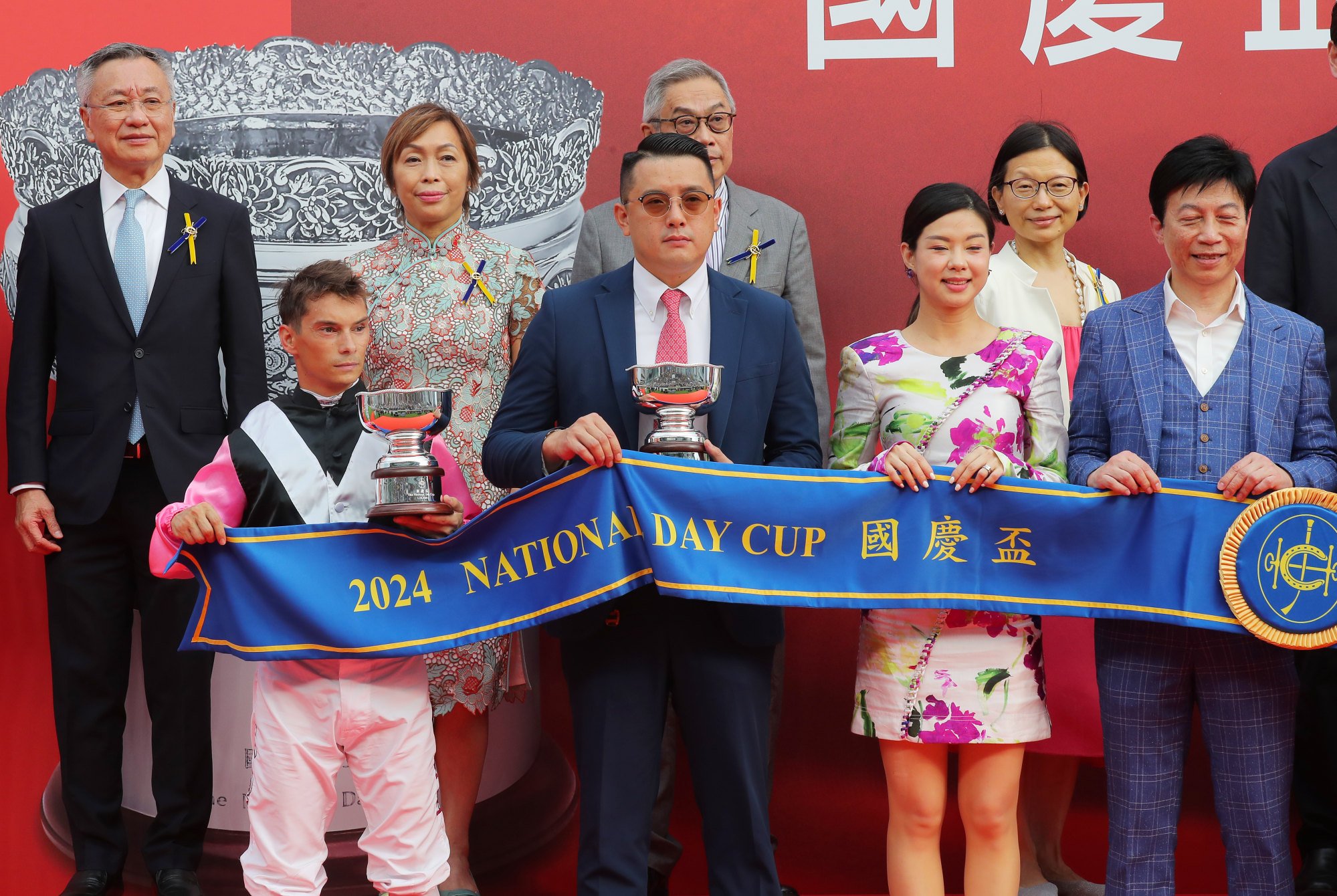 Jockey Alexis Badel and trainer Pierre Ng with their National Cup Day trophies.