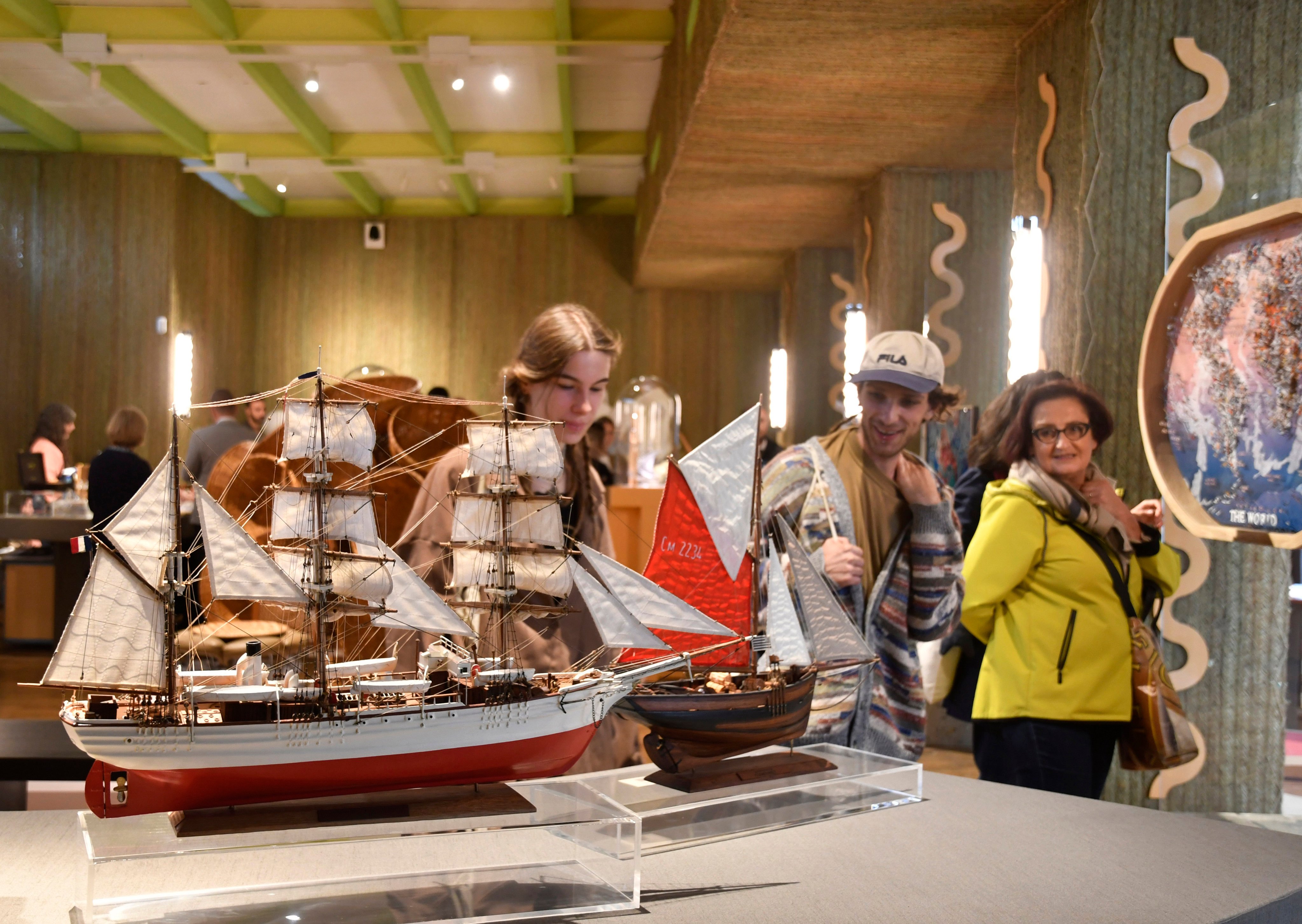 Visitors attend an exhibition of model ships made by Le Village at the Homo Faber 2024 show in Venice, Italy, on September 13, 2024. The Madagascan company makes exact replicas of some of history’s most famous ships, such as the Titanic and HMS Bounty. Photo: AP