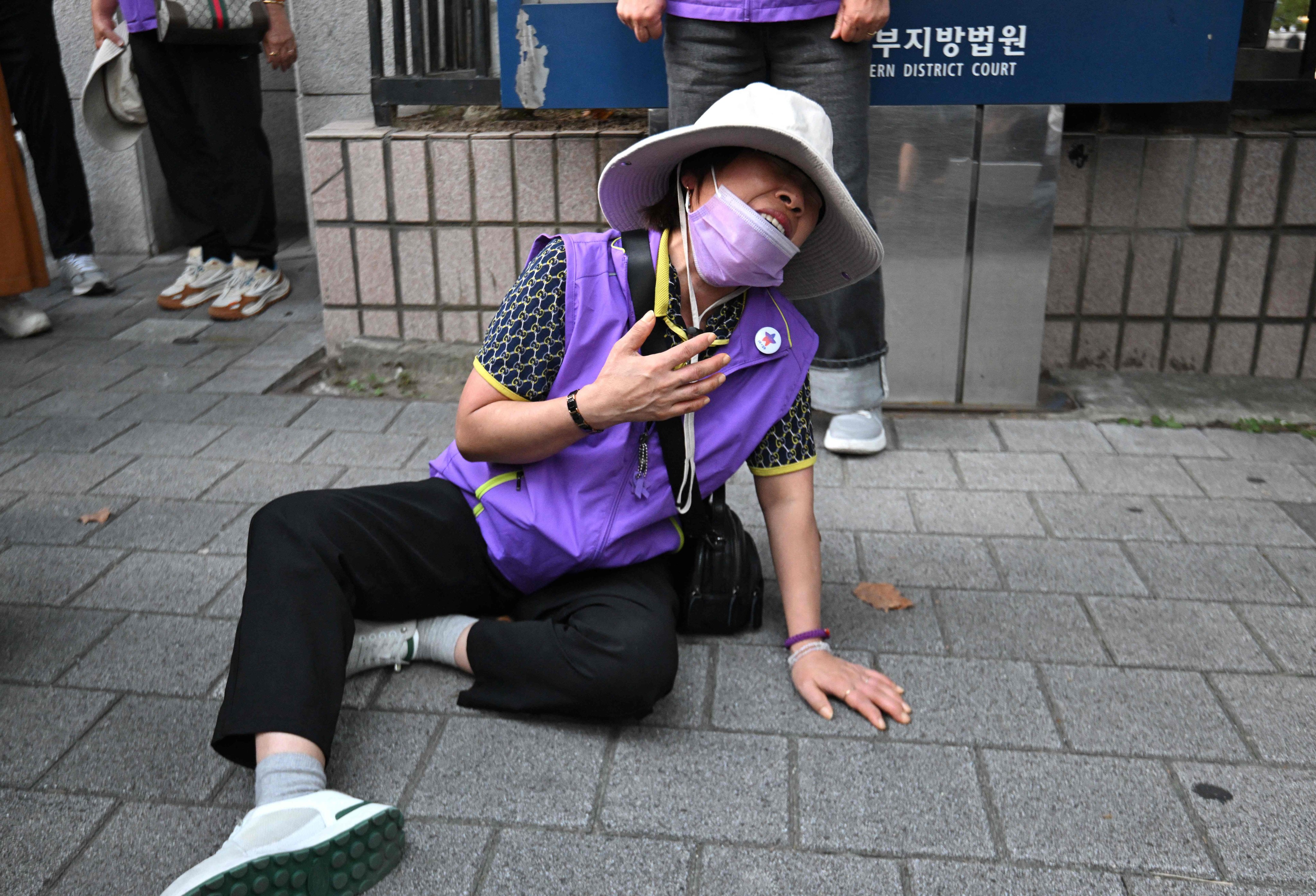 A family member of one of the Halloween crush victims cries in anguish at the Seoul Western District Court. Photo: AFP