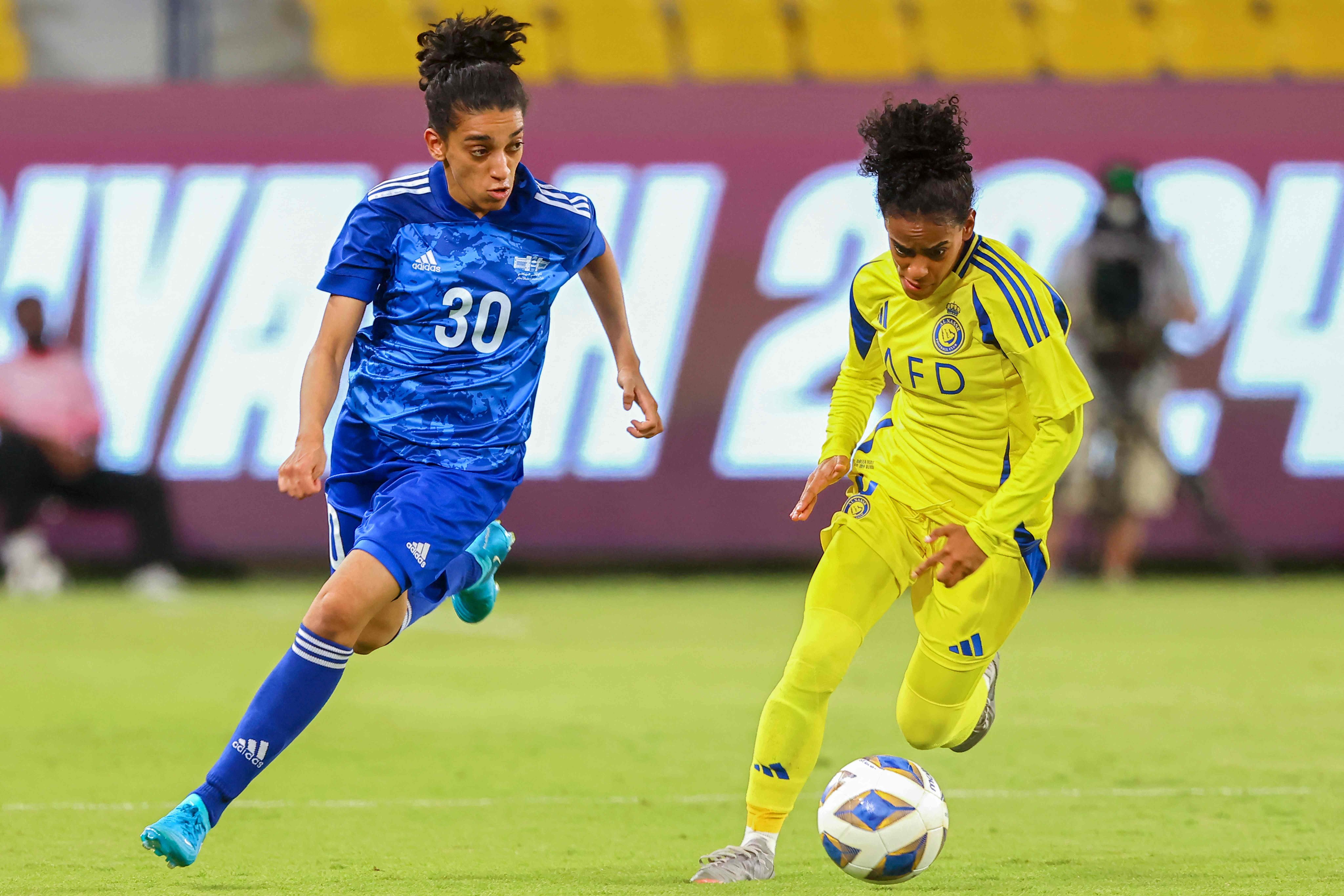 Abu Dhabi Country’s Naeema vies for the ball with Al-Nassr forward Mubarkh al-Saiari during their AFC Champions League qualfier. Abu Dhabi won 1-0 to make it to the main event, which starts on Thursday. Photo: AFP