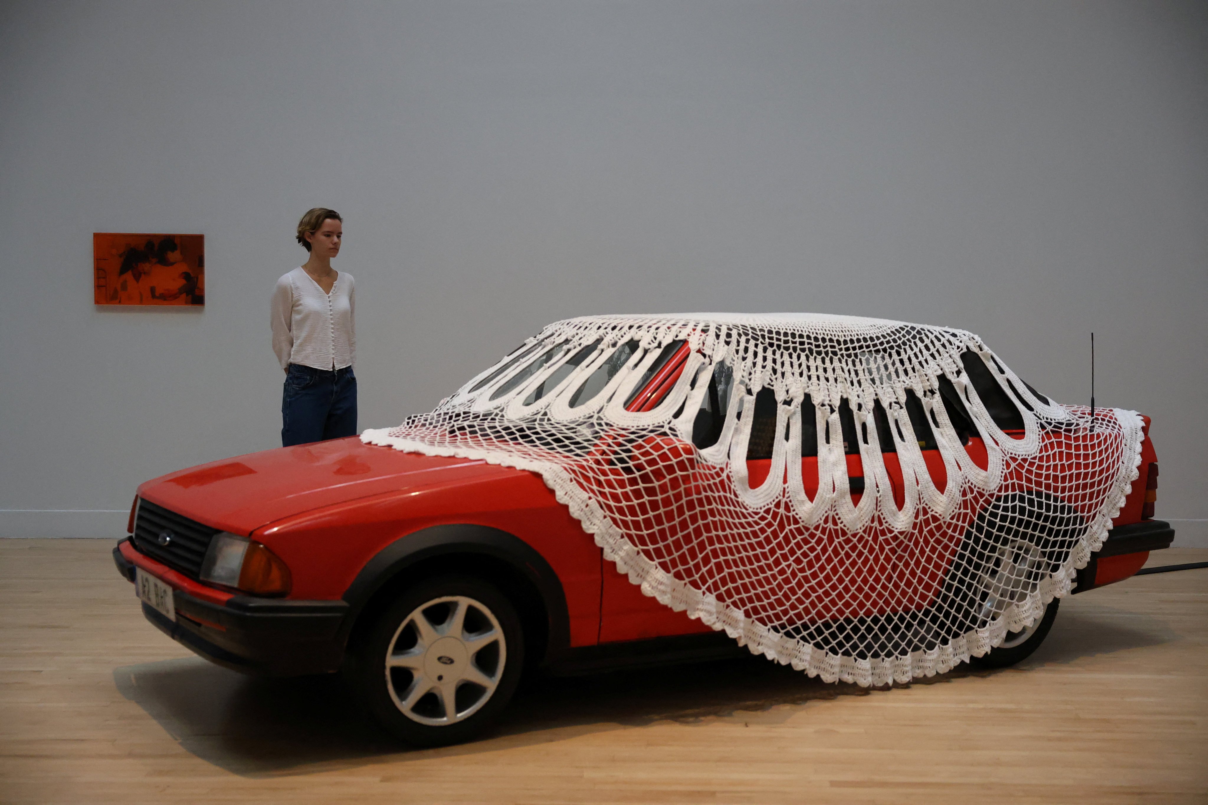 A gallery assistant poses with Turner Prize shortlisted artist Jasleen Kaur’s installation at the Tate. Photo: Reuters