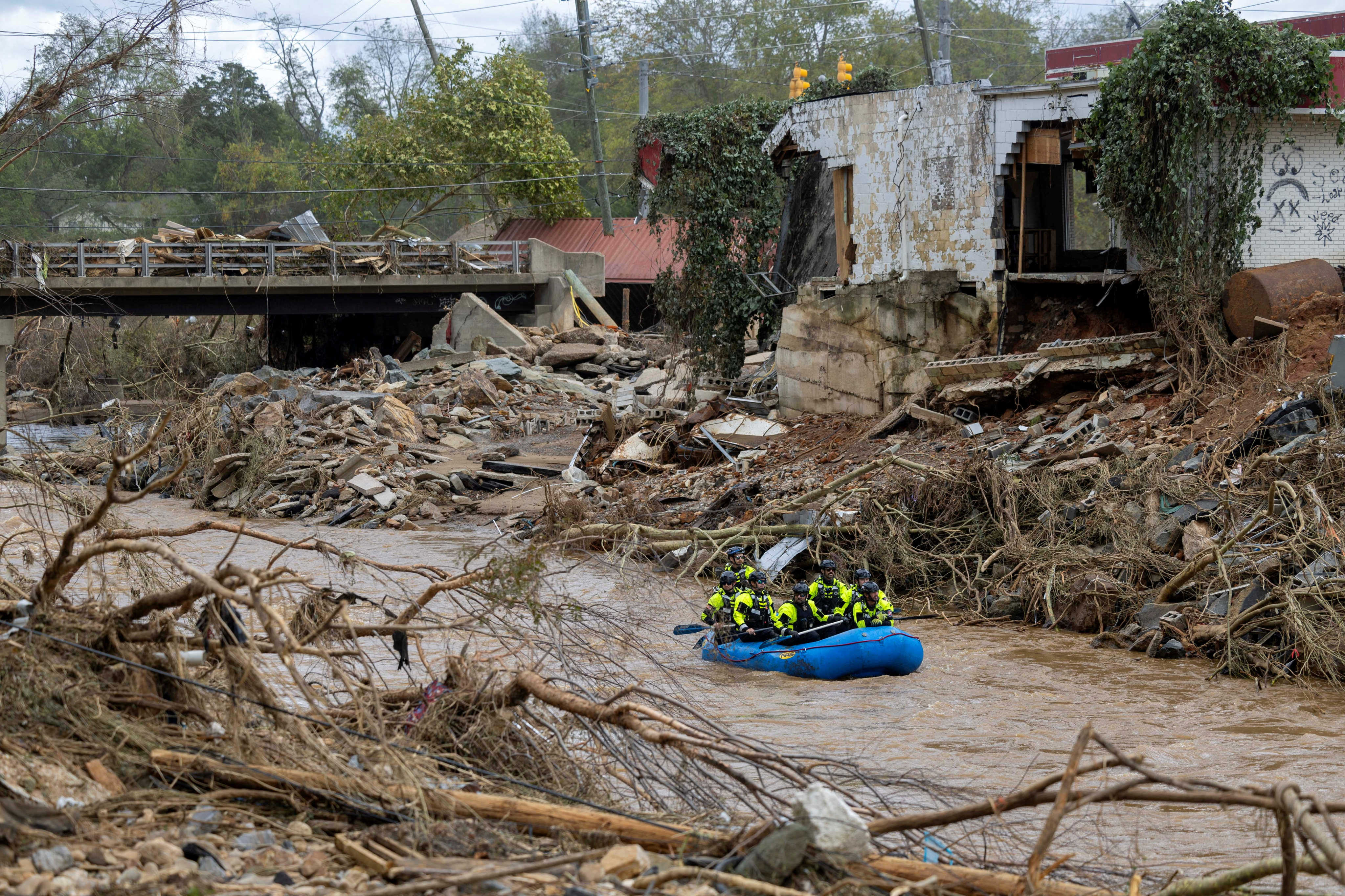 A rescue team paddles down the Swannanoa River in western North Carolina. Photo: The News & Observer via Reuters 