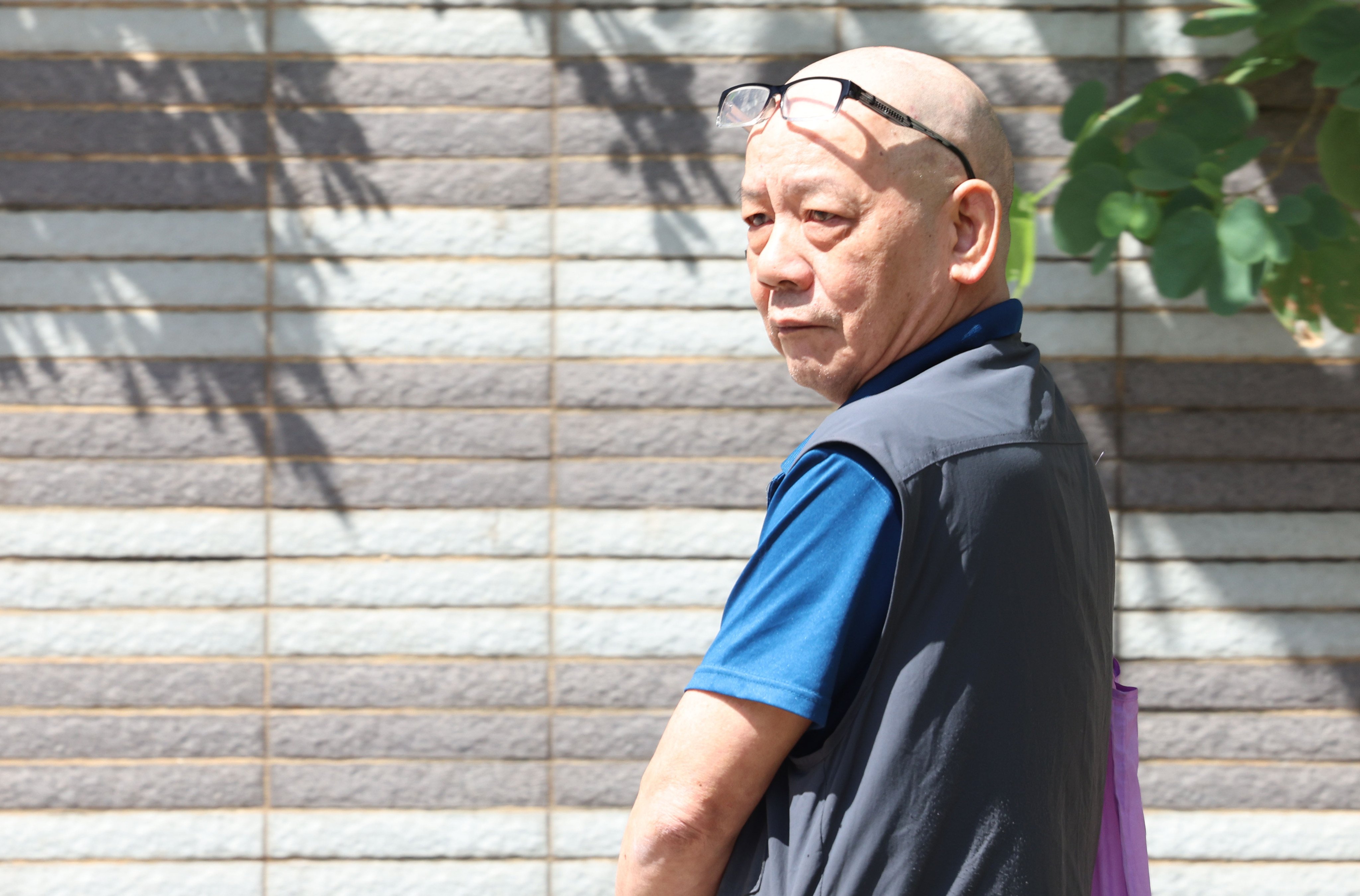 Taxi driver Lui Kwan-ying, 66, leaves Kowloon City Court on Wednesday. Photo: Brian Wong