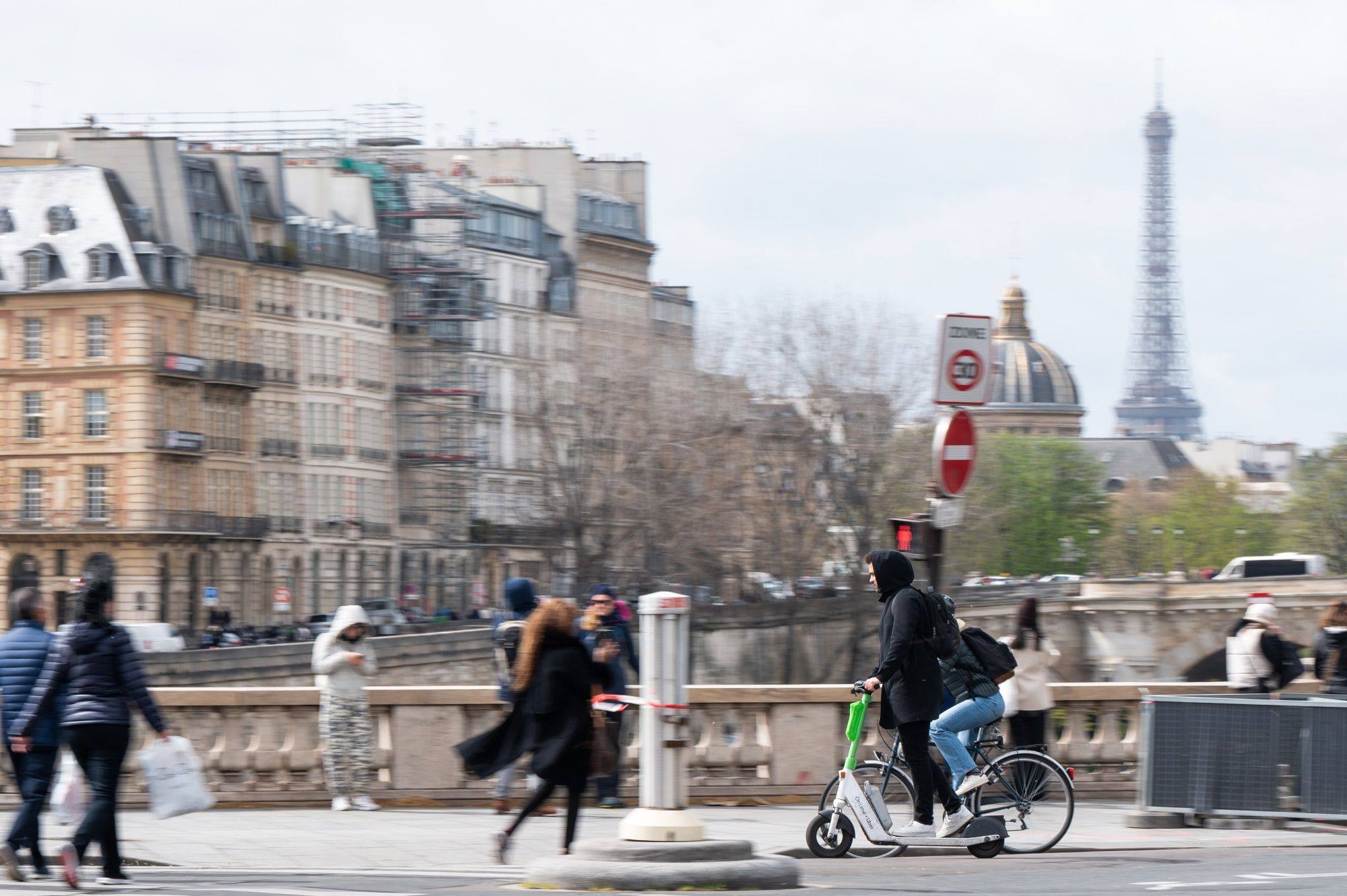 A rider on a public hire electric scooter in a cycle lane in Paris in April 2024. Photo: Bloomberg