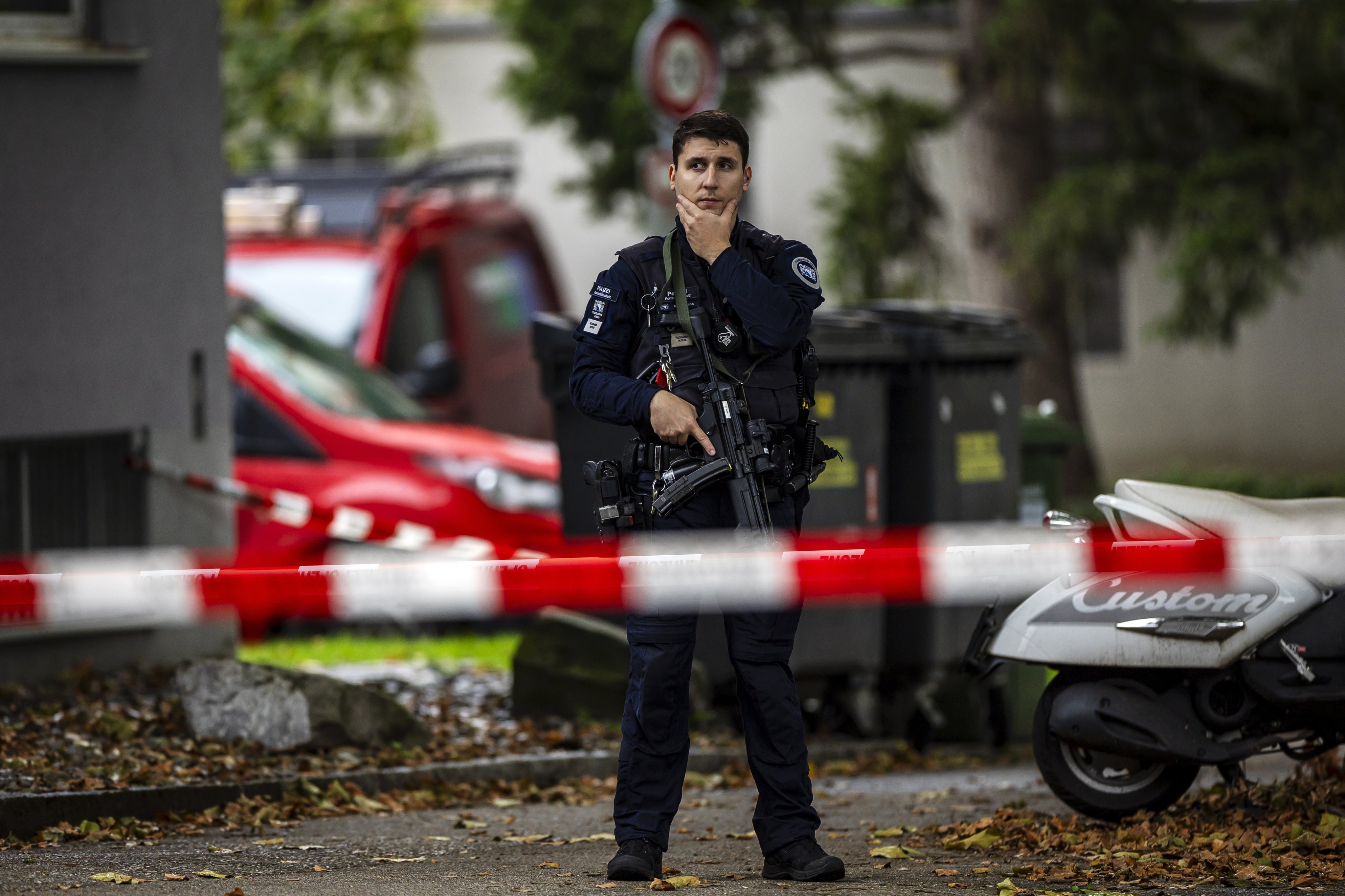 An armed policeman stands outside a daycare in Zurich after a knife attack on Saturday. Photo: EPA-EFE