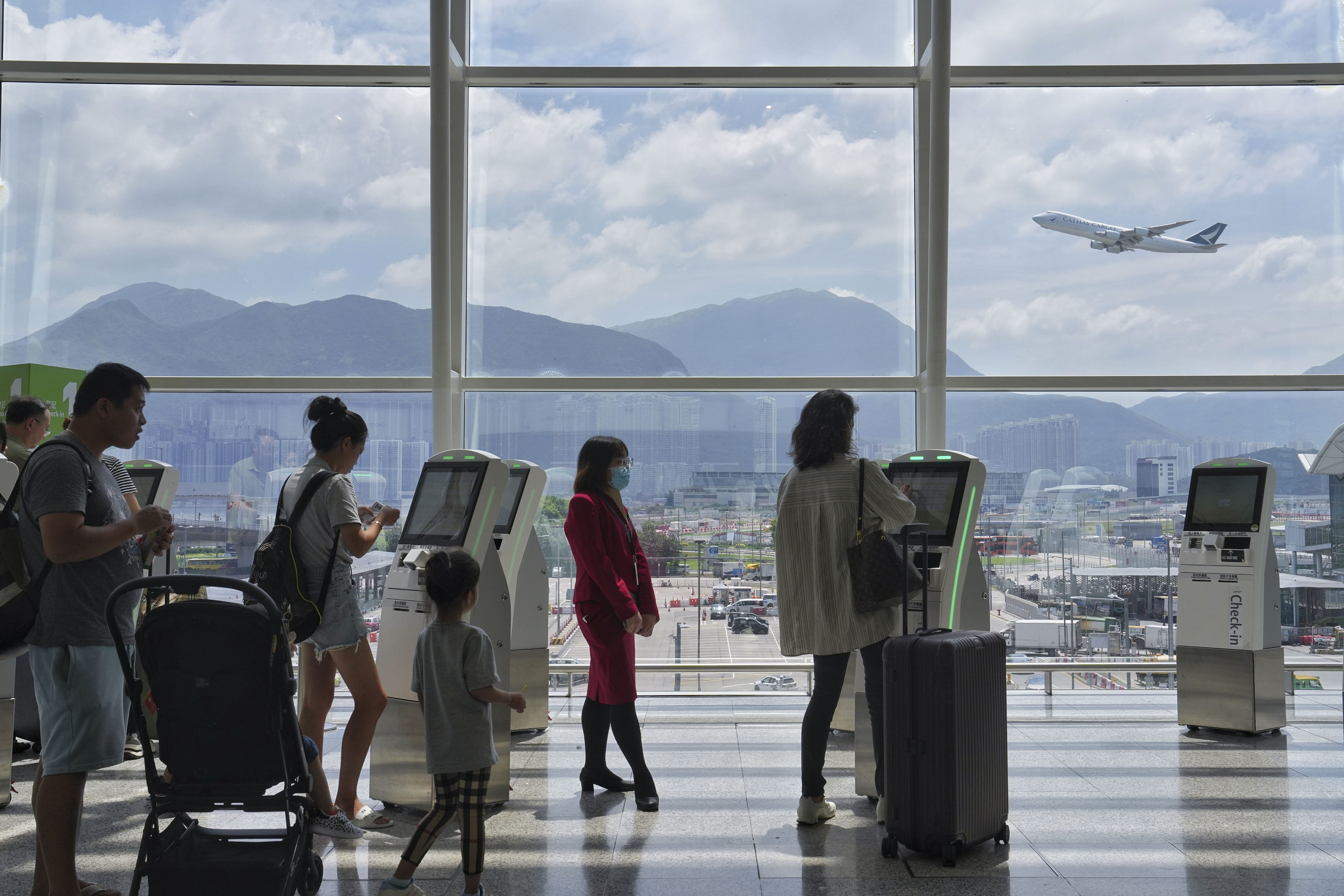 Passengers at the Cathay Pacific self check-in kiosks at Hong Kong International Airport in September. Photo: Elson Li