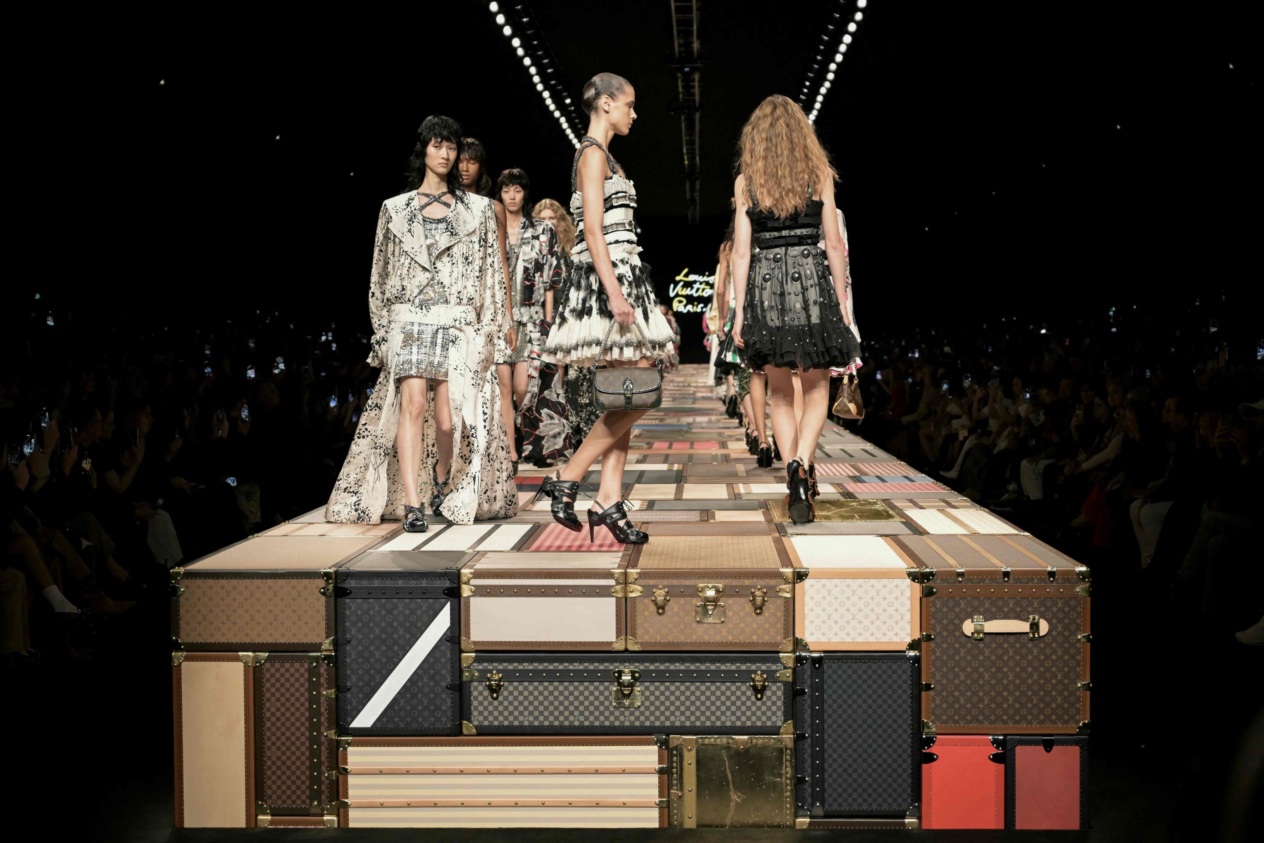 Models walked on a raised runway made of Louis Vuitton trunks at the label’s spring/summer 2025 show during Paris Fashion Week. Photo: AFP