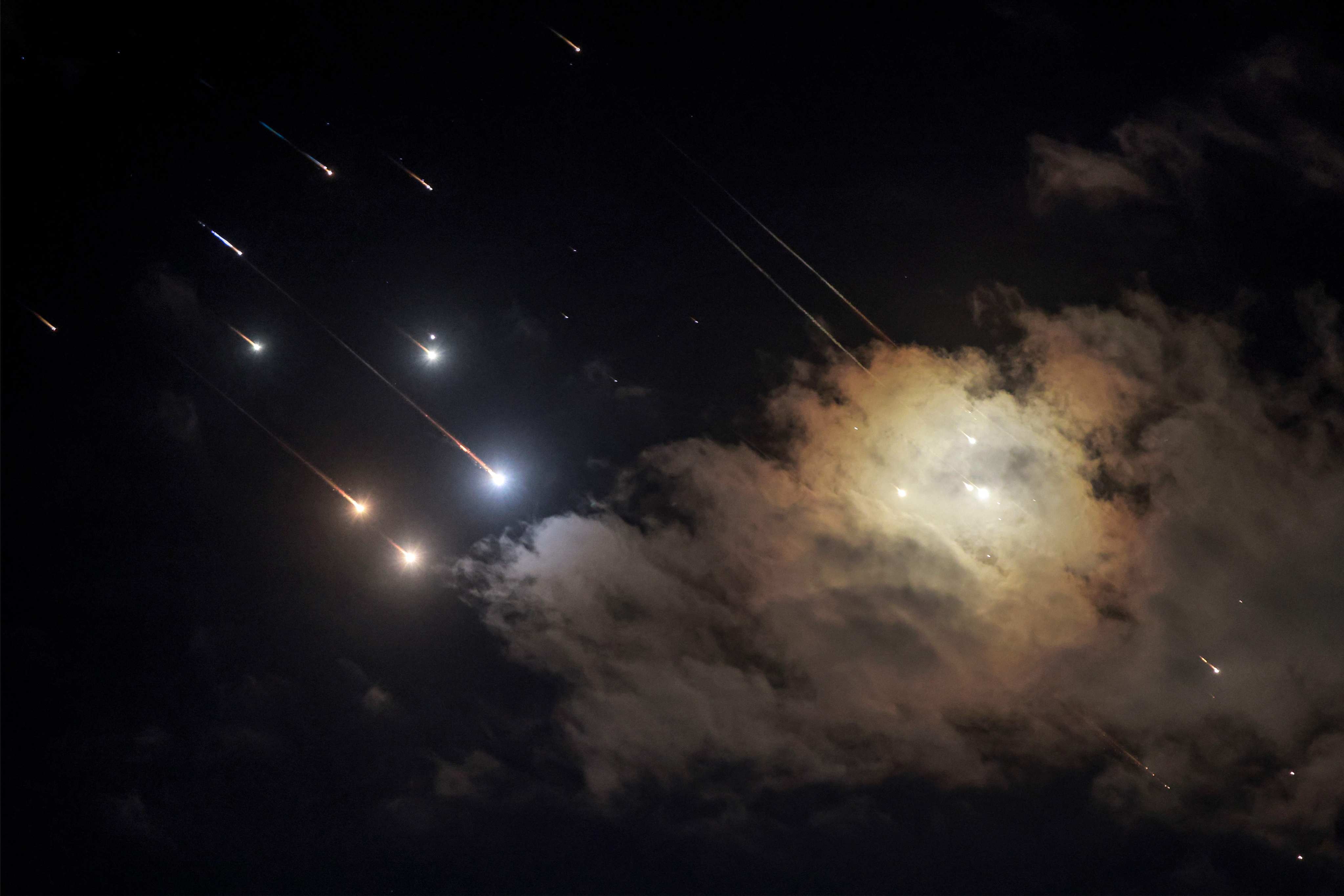 Projectiles are intercepted by Israeli air defences near the northern city of Baqa al-Gharbiya on Saturday. Photo: AFP