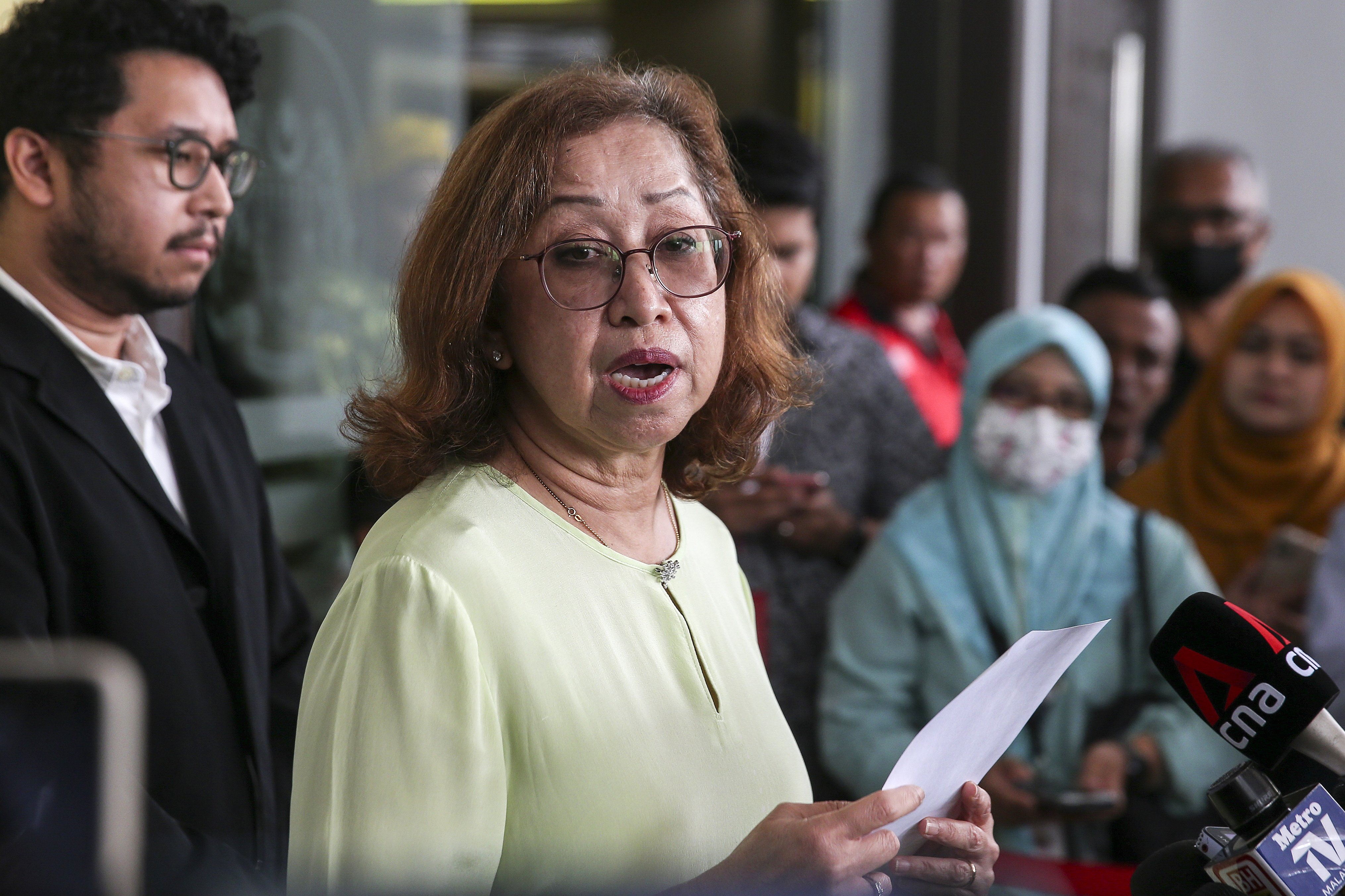 Wife of ex-finance minister Daim Zainuddin, Naimah Khalid, speaks to the media after a court session in Kuala Lumpur in January. Photo: EPA-EFE