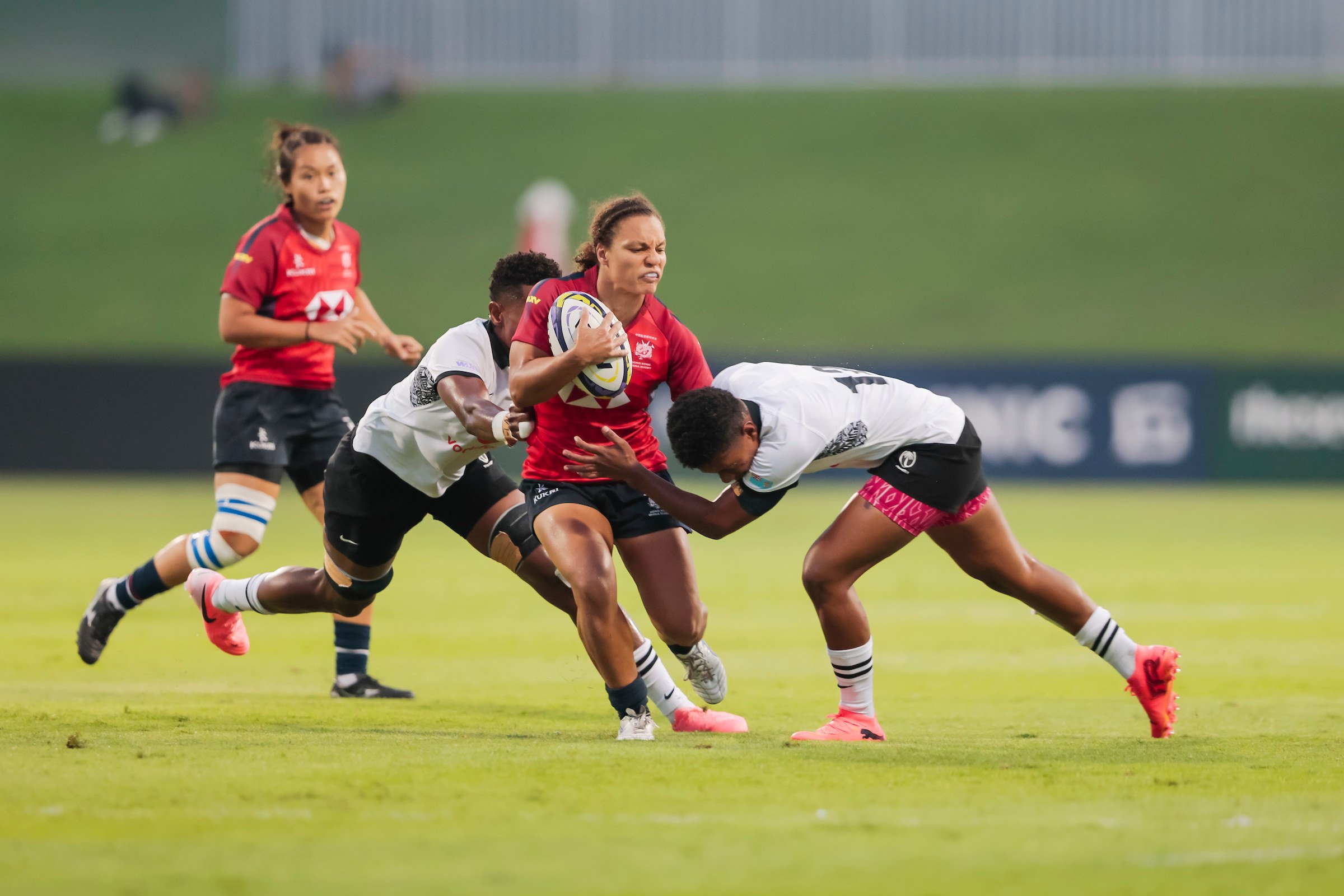 The tough Fijians stop Hong Kong inside-centre Natasha Olson-Thorne in her tracks as the Pacific islanders triumphed 38-3 last Saturday. Photo: Charles Verghese