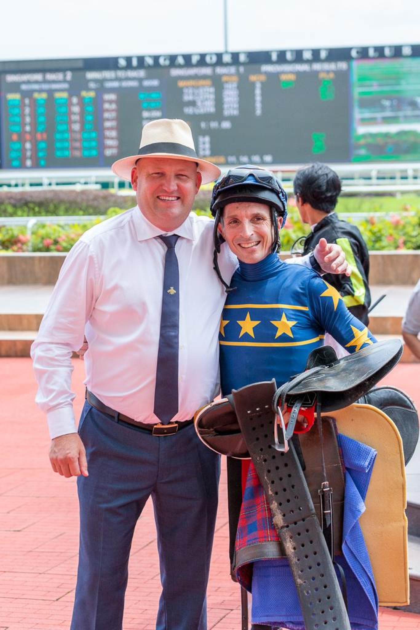 Trainer Dan Meagher and jockey Danny Beasley celebrate a winner at Kranji. Photo: Charmaine/SG Racing