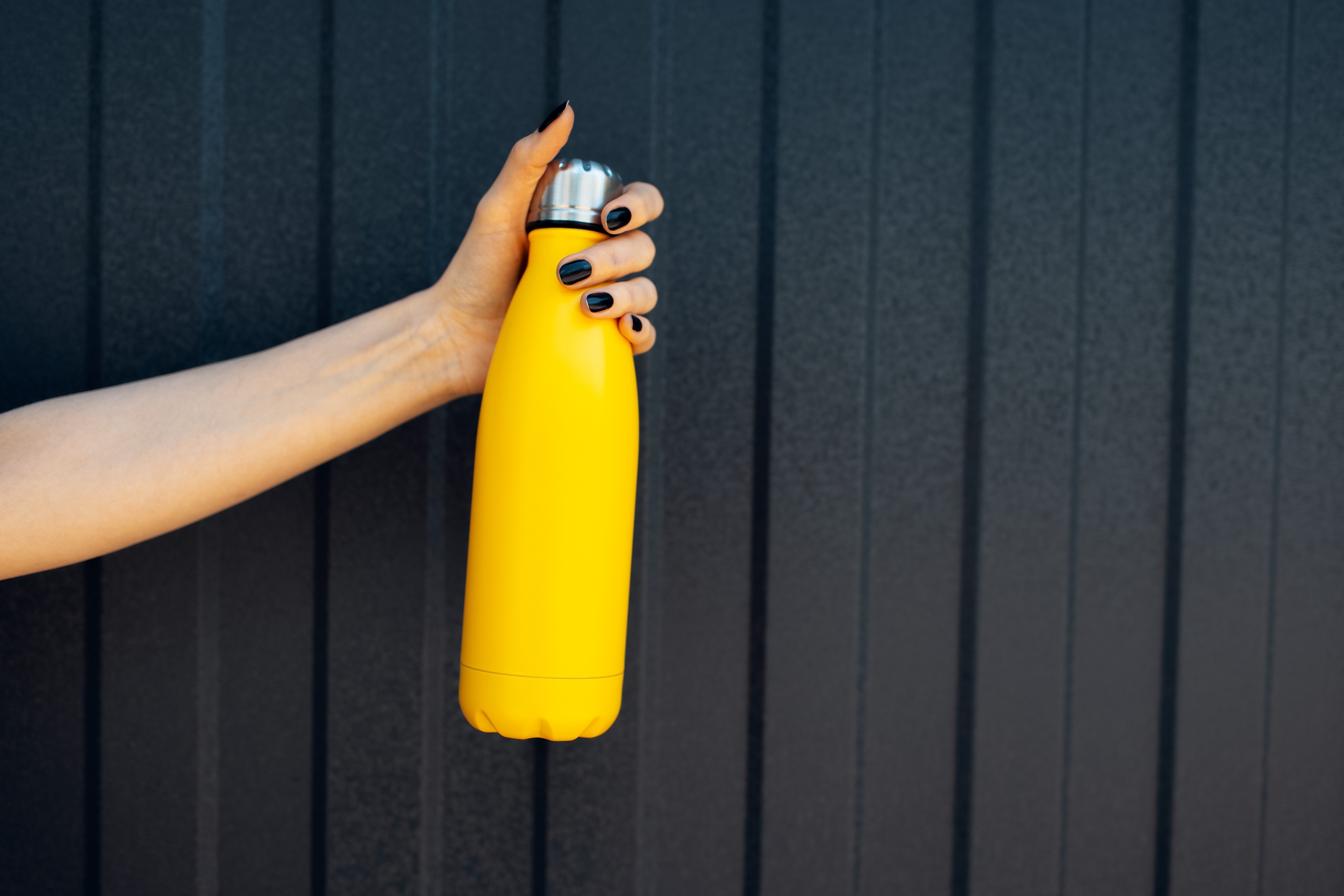 Reusable water bottles are much better for the Earth than disposable ones, but be careful about the germs hiding under the lid. Photo: Shutterstock