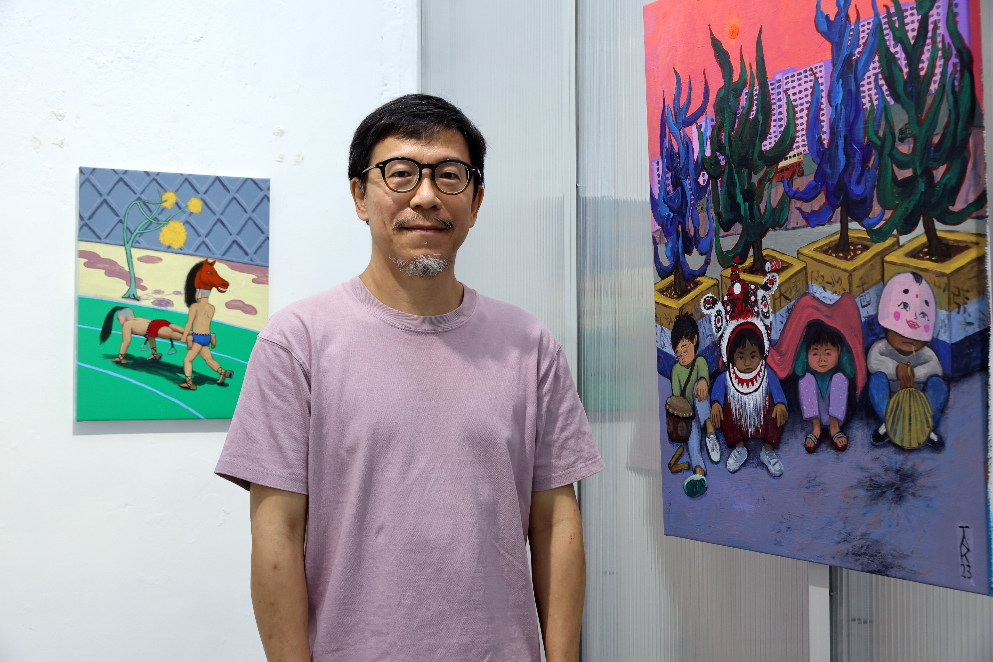 Hong Kong artist Yeung Hok-tak with two of his paintings at Kiang Malingue gallery in Aberdeen on September 25, 2024. His solo exhibition “I See You There” runs at the gallery until October 19. Photo: Edmond So