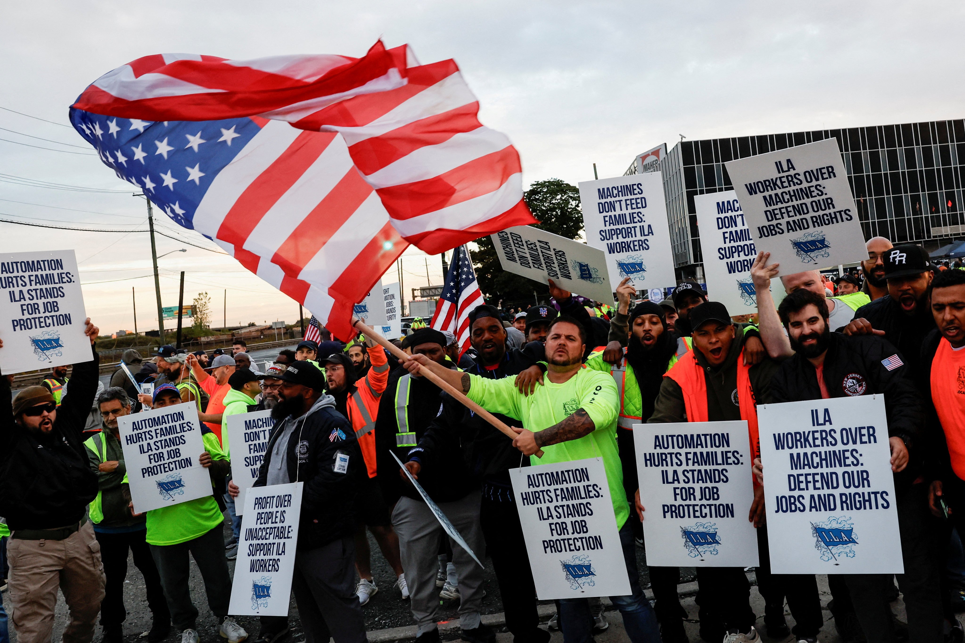 Members of the International Longshoremen’s Association union, which represents roughly 45,000 workers, are on strike outside Maher Terminal in Elizabeth, New Jersey, on Tuesday. Photo: Reuters