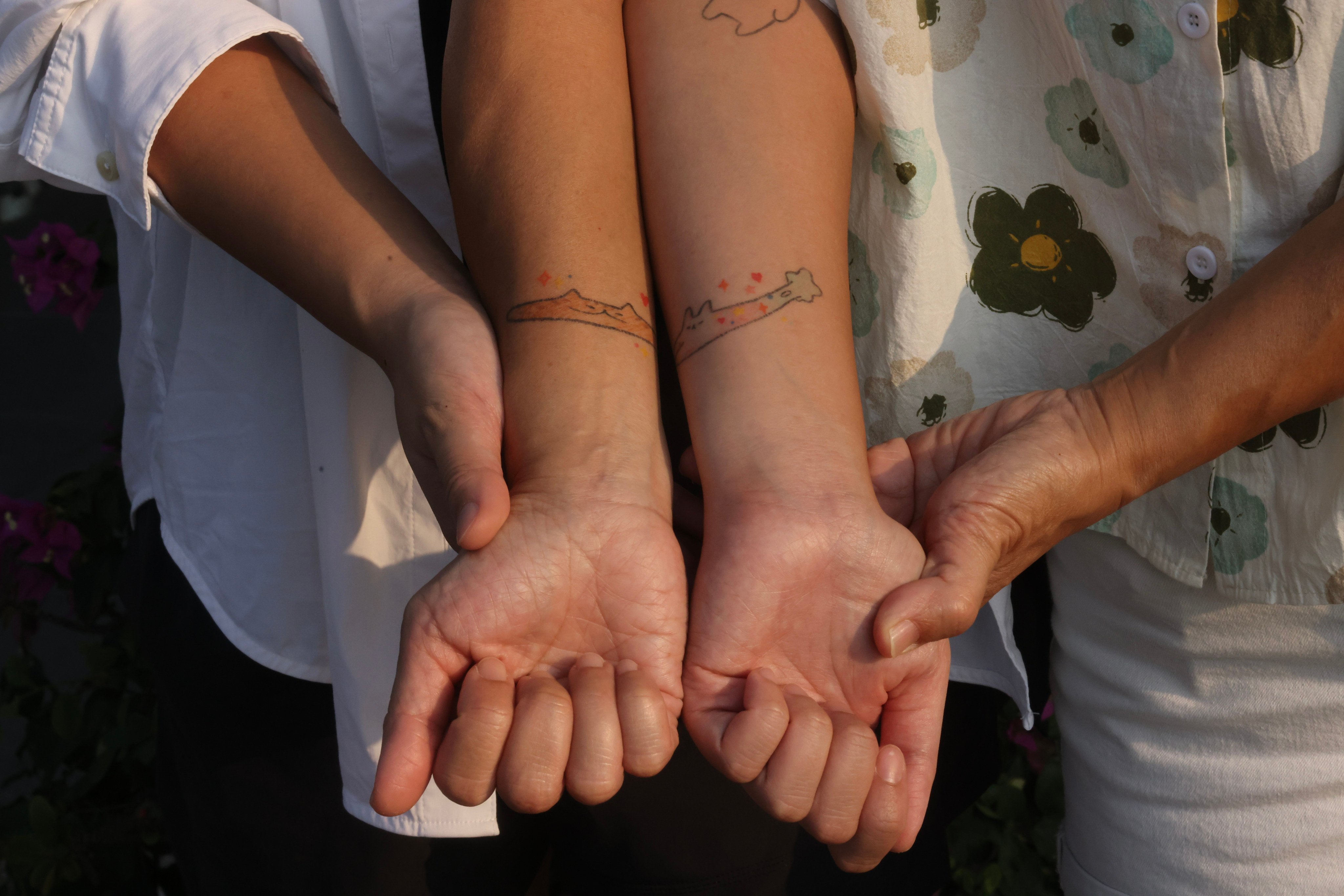 Victoria Chan Wing and her mother, Angela Lee, show their mother-daughter tattoos. Attitudes towards women getting tattoos are changing in Hong Kong. Photo: Jonathan Wong