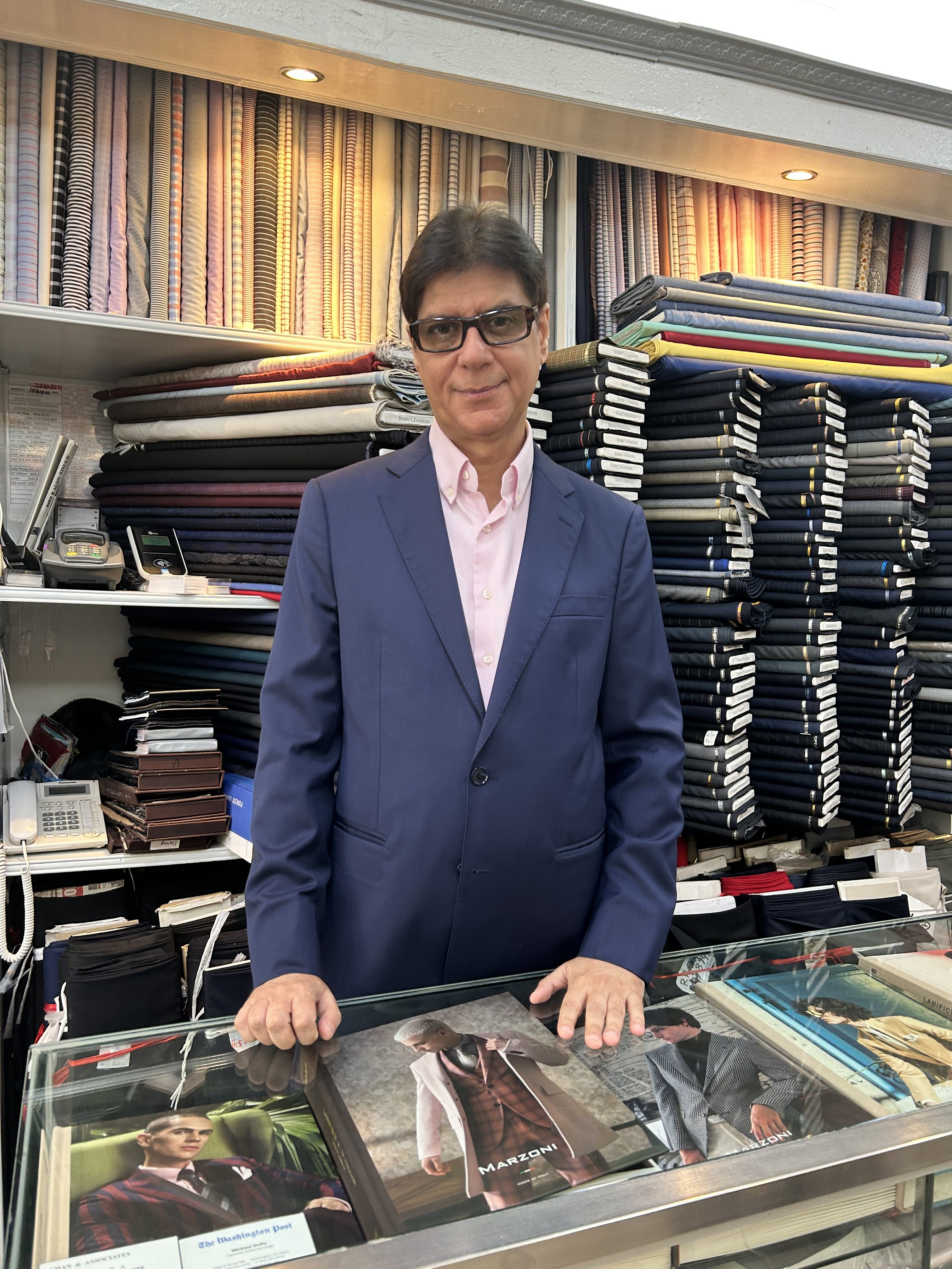 Bobby Daswani runs Bobby’s Fashions alongside his brother Nick. He is the third generation in his family to run the tailoring business. Photo: Kathryn Giordano