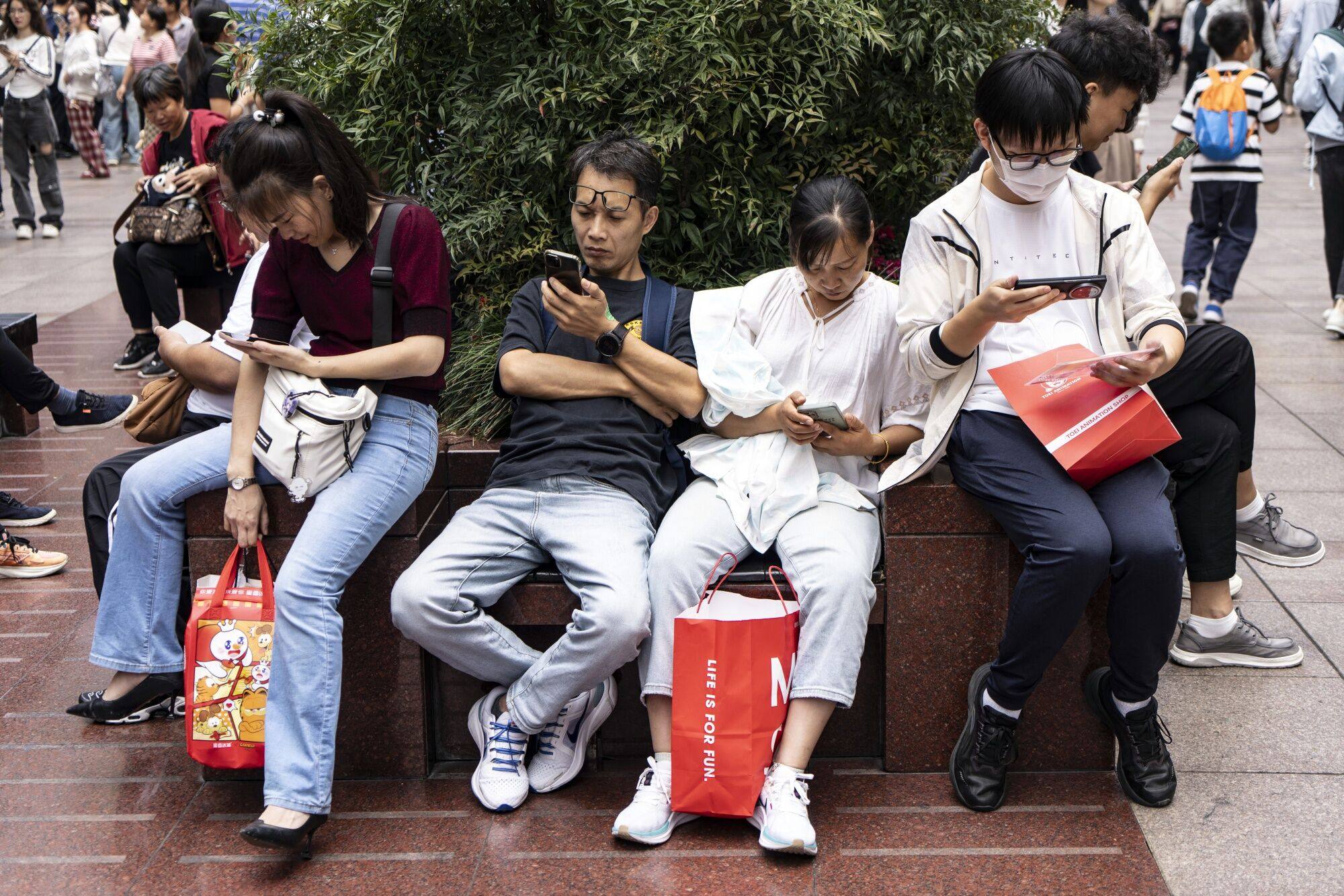 Shoppers on Nanjing East Road in Shanghai. Photo: Bloomberg