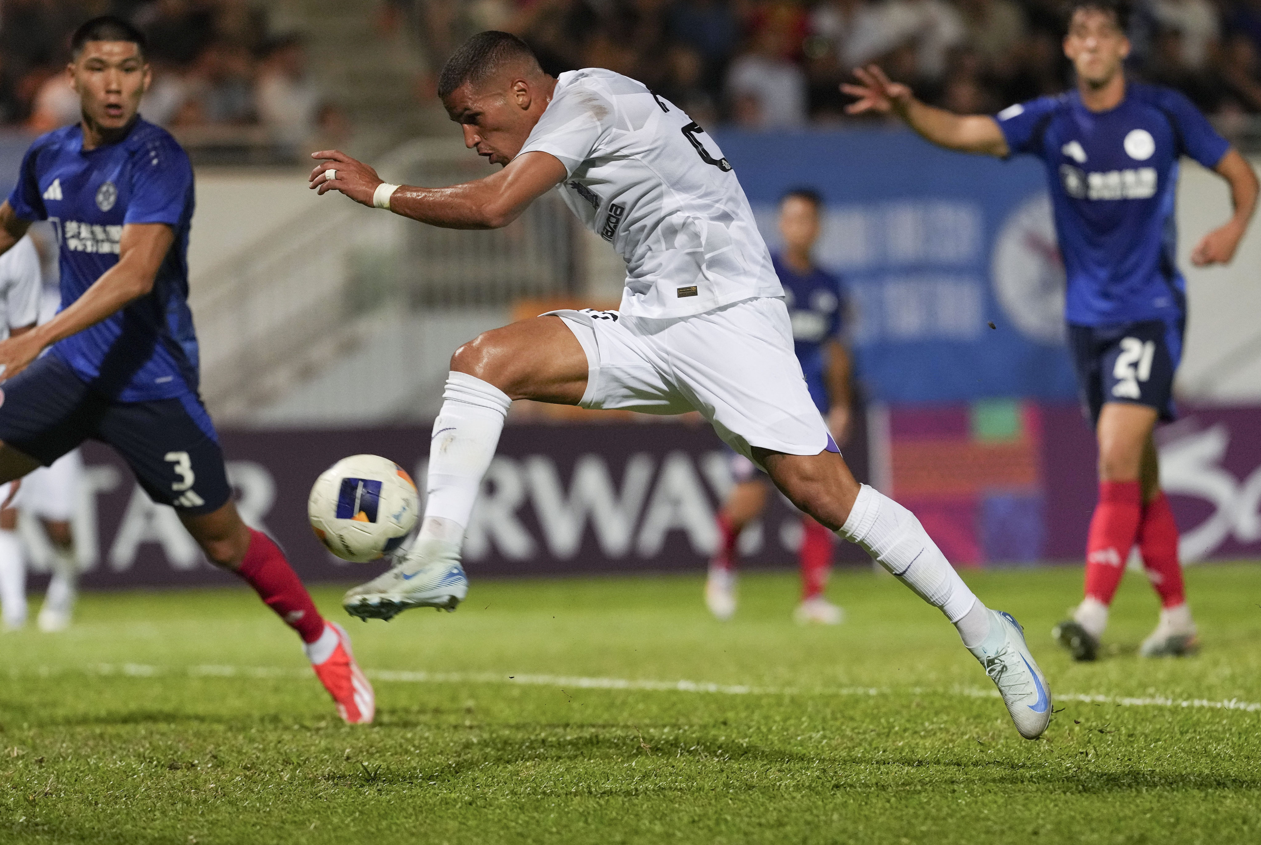 Eastern vs Sanfrecce Hiroshima in the second game of Asian Champions League Two, held at Mong Kok Stadium. Sanfrecce Hiroshima’s Pieros Sotirou (white no.20) tries a shot. Photo: Elson Li