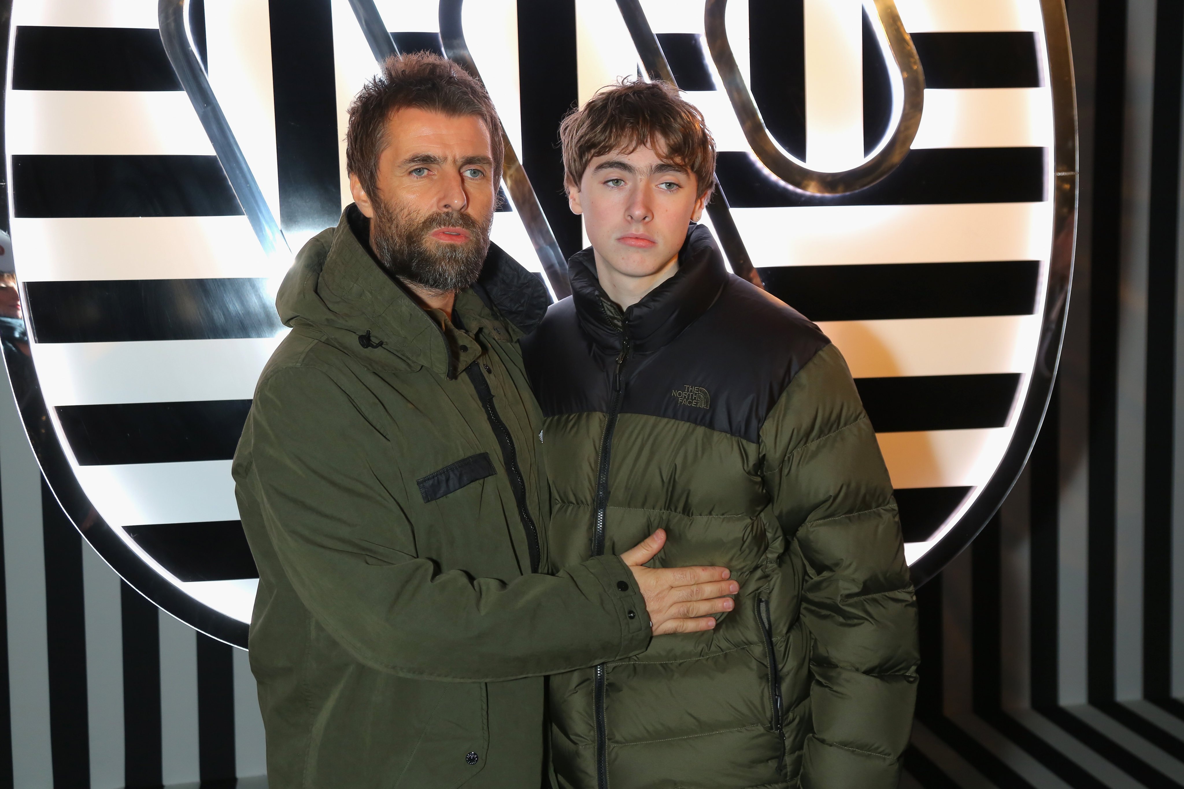 Matching eyebrows: Oasis singer Liam Gallagher with his son, Gene Gallagher. Photo: Getty Images