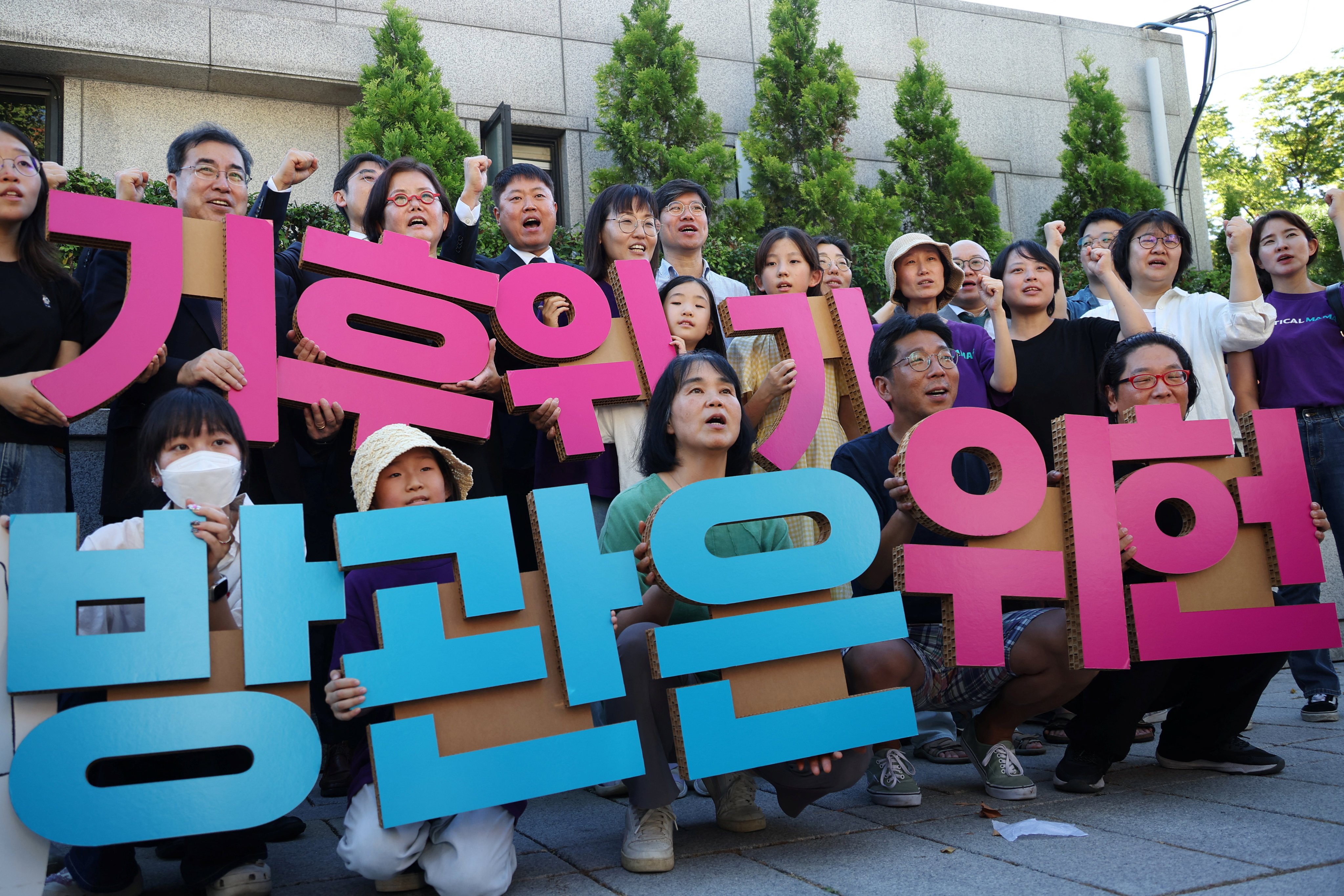 Climate activists in South Korea celebrate the constitutional court ruling that the country’s climate change law was conditionally unconstitutional, in Seoul on August 29. Their message? “Doing nothing for climate change is unconstitutional.” Photo: Reuters