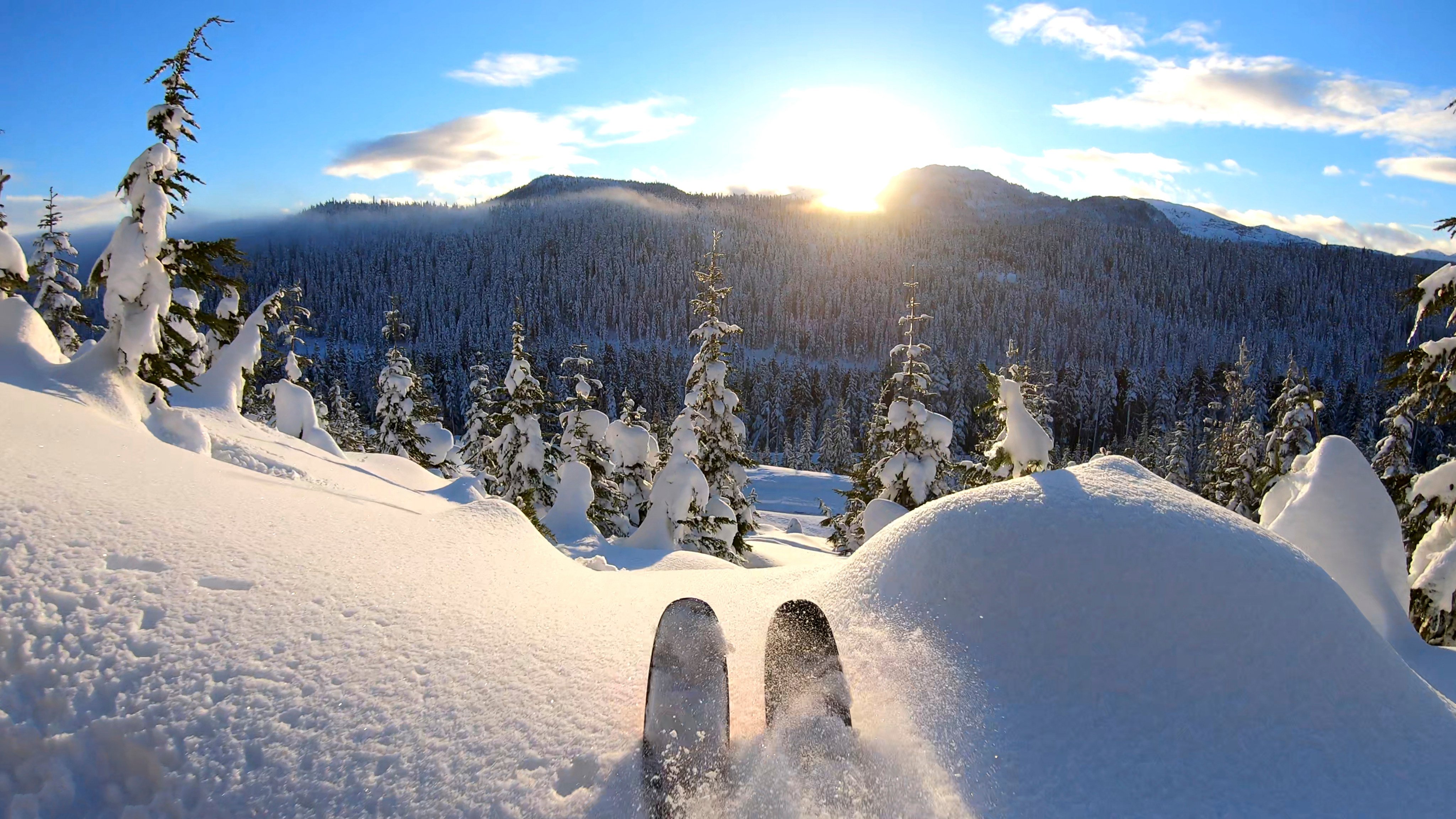 A sunny and snowy mountain scene in the distance. Photo: Getty Images