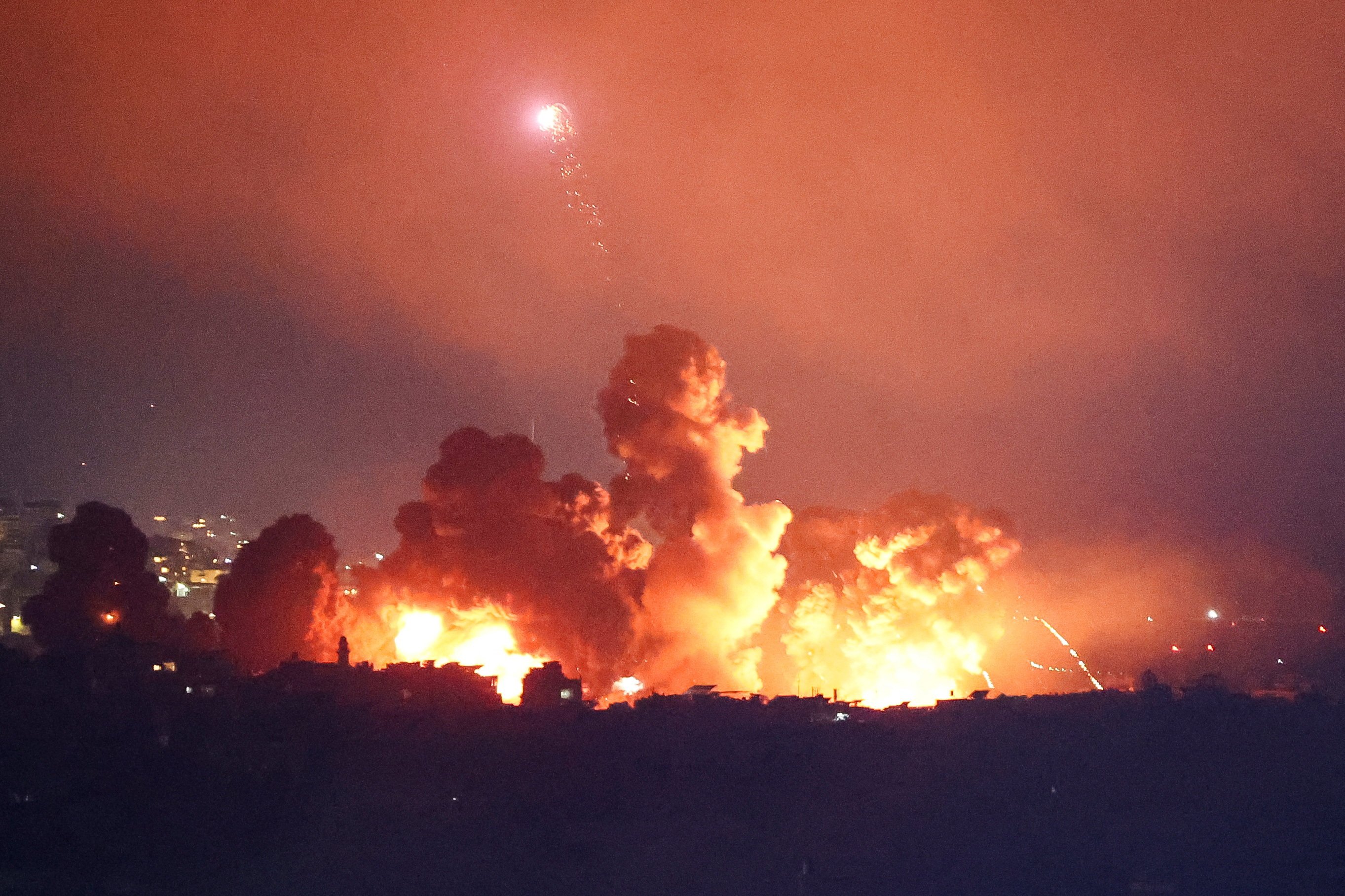 Smoke and flames rise over Beirut’s southern suburbs after an Israeli strike on Thursday. Photo: Reuters