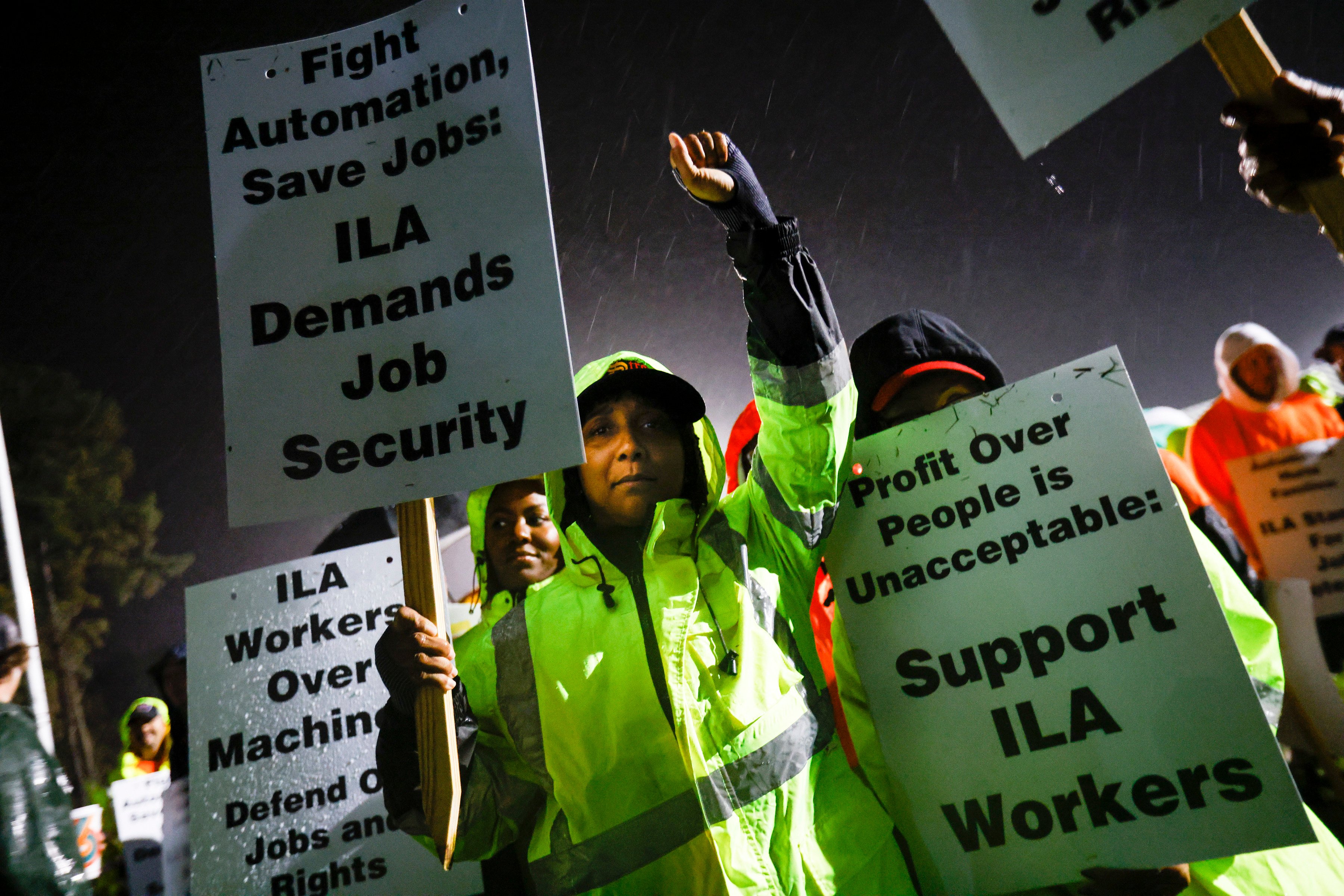 Dock workers strike outside the Virginia International Gateway in Portsmouth, Virginia, on Tuesday. Photo: The Virginian-Pilot via AP