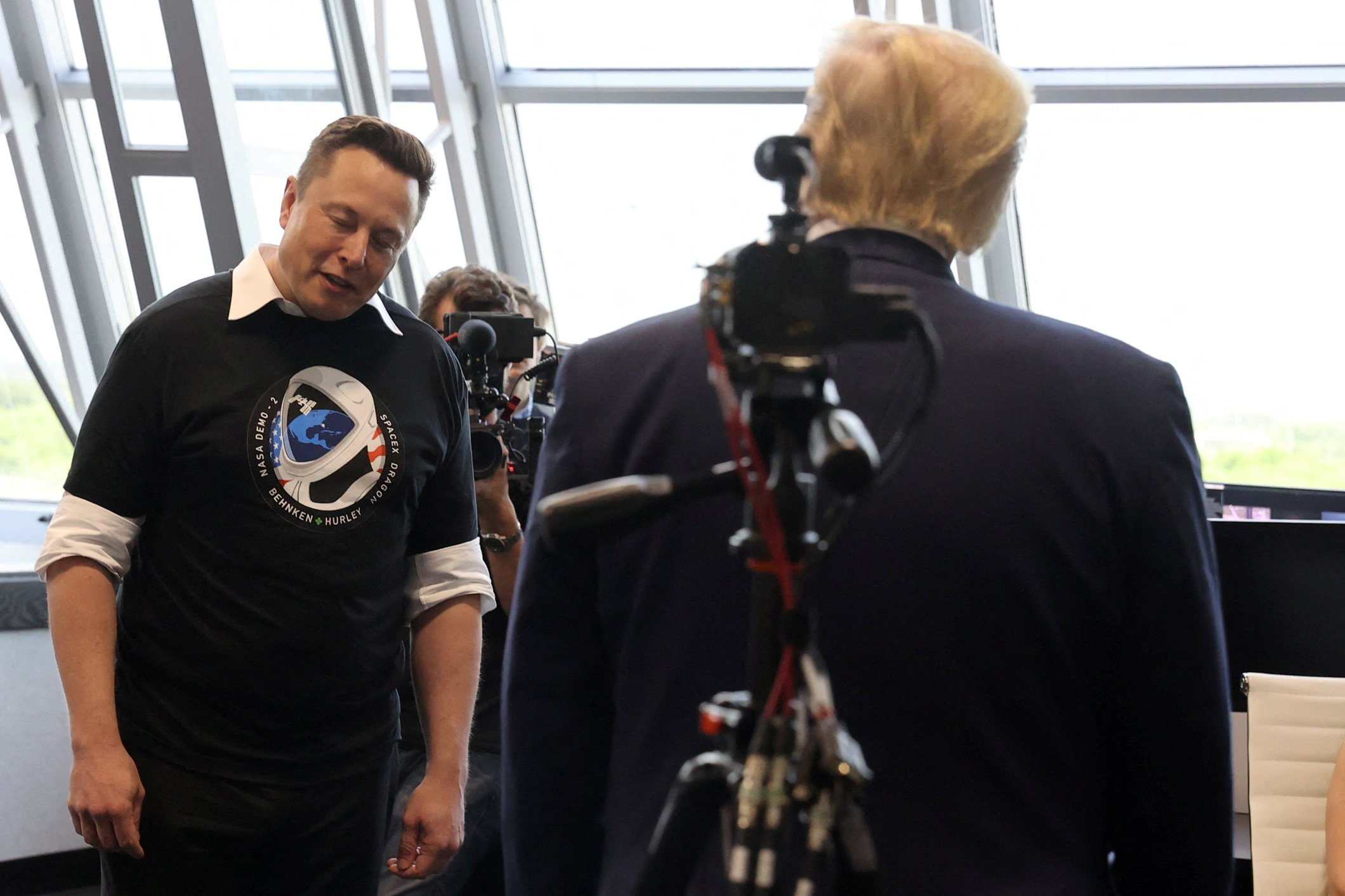 Elon Musk gives a small bow of the head as former president Donald Trump congratulates him after the launch of a SpaceX Falcon 9 rocket and Crew Dragon spacecraft. Photo: Reuters