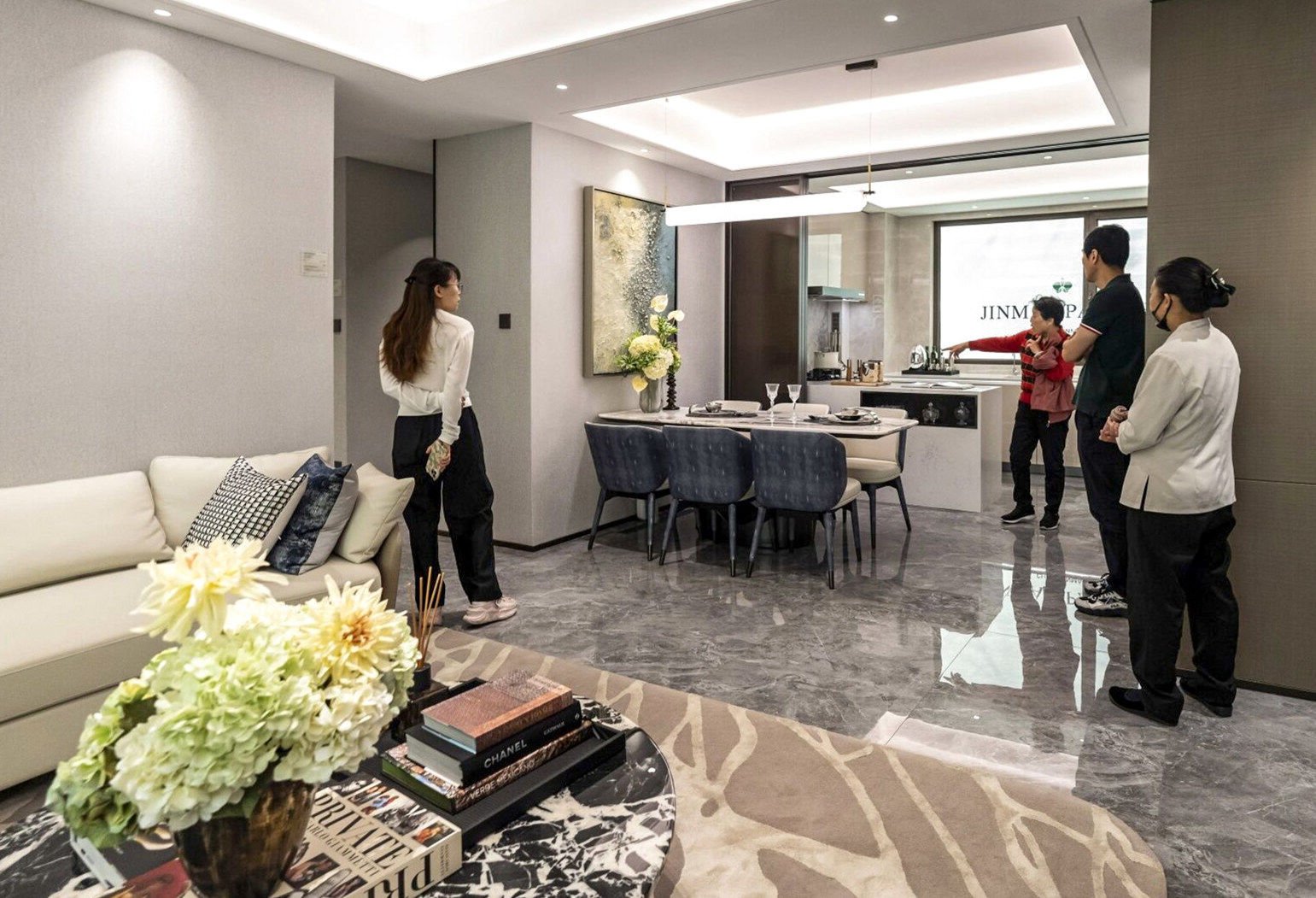 People visit a show flat for a residential project in Shanghai on Thursday. Photo: Bloomberg