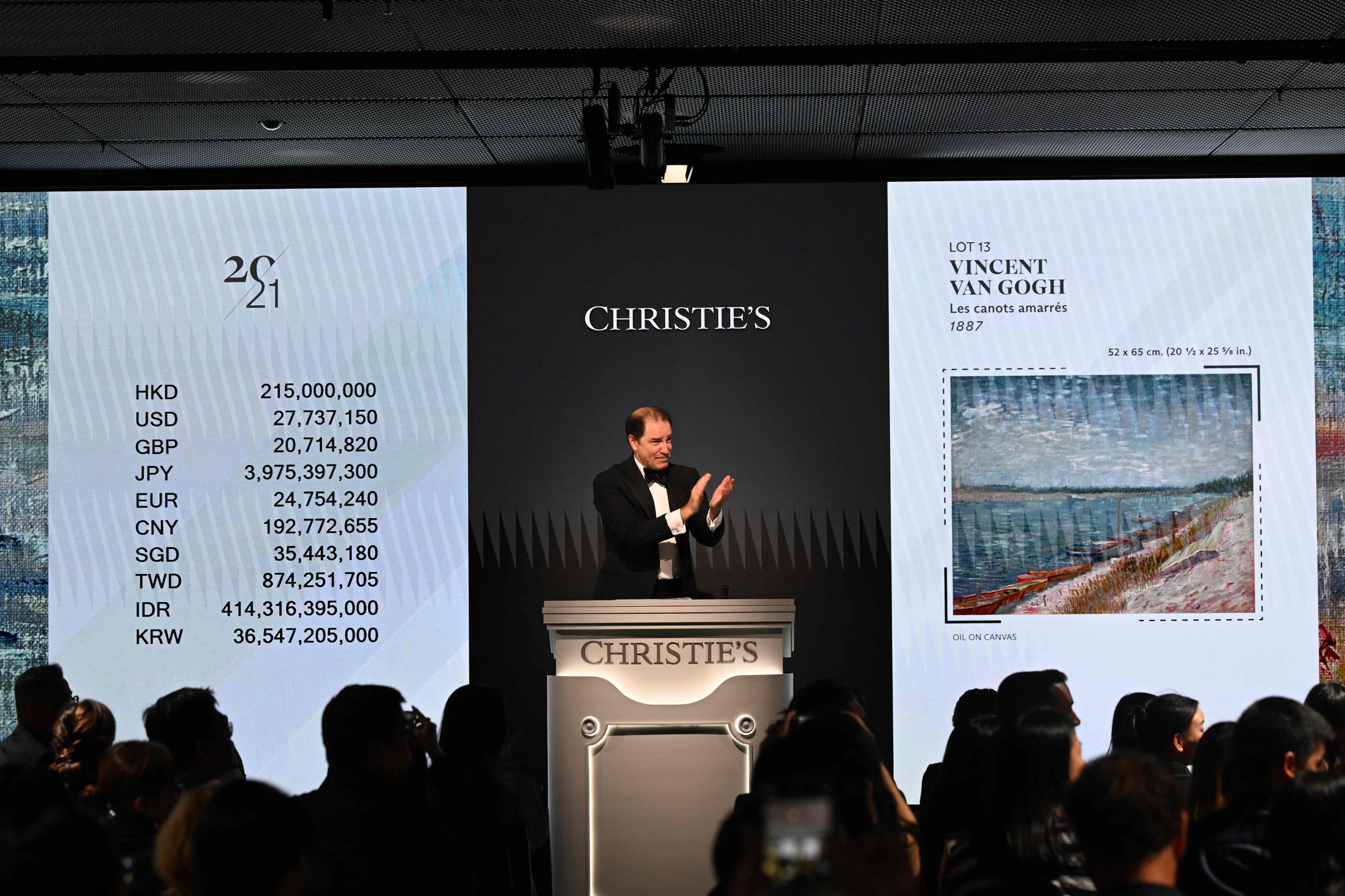 Bids are taken on “Les canots amarrés” by Vincent Van Gogh from 1887, which recently sold at auction at Christie’s Hong Kong headquarters for HK$215,000,000 (US$27.7 million) in Hong Kong. Photo: AFP