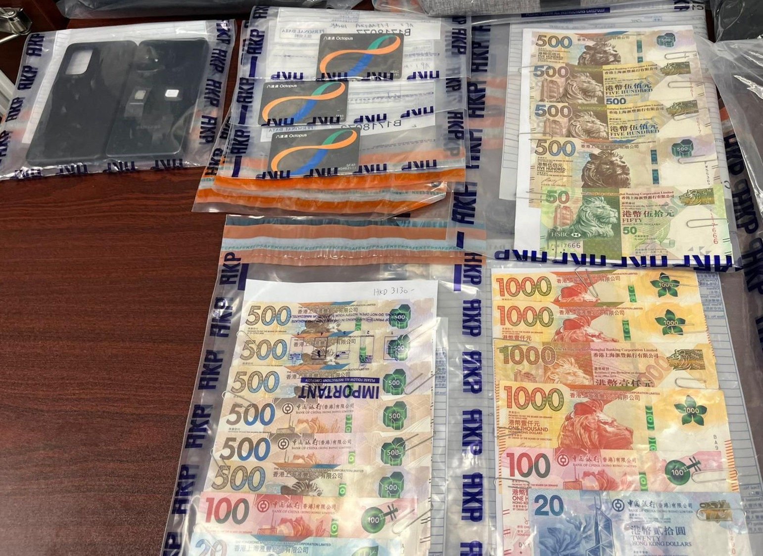 Hong Kong police have arrested a trio suspected of targeting victims who had withdrawn money from ATM machines and banks. Photo: Handout