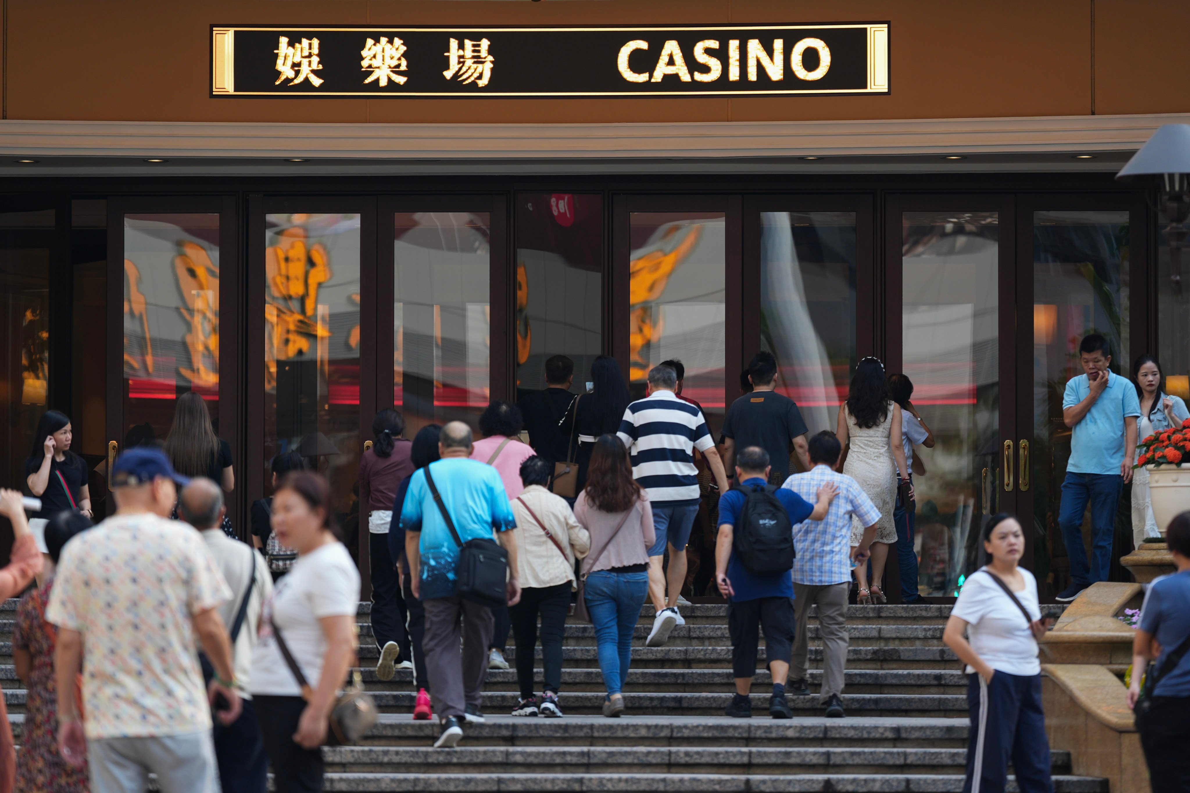 People enter a casino in Macau’s Lisboa district. Photo: Eugene Lee