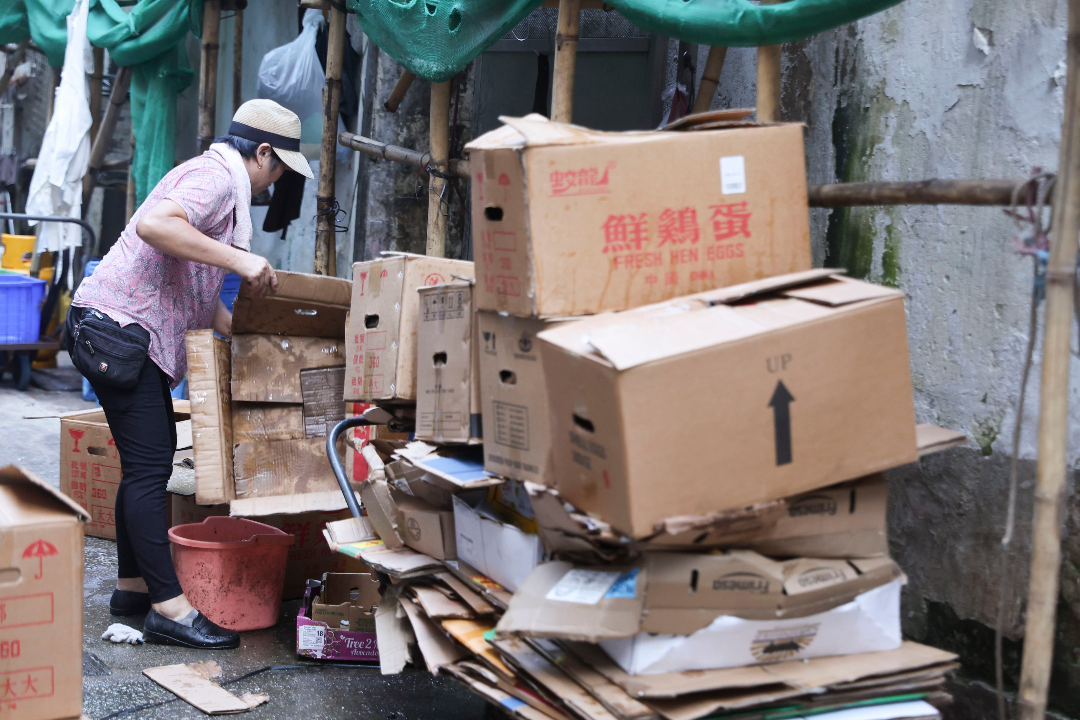 A woman collects 
cardboard on the streets of Hong Kong’s Wan Chai district. Photo: Edmond So