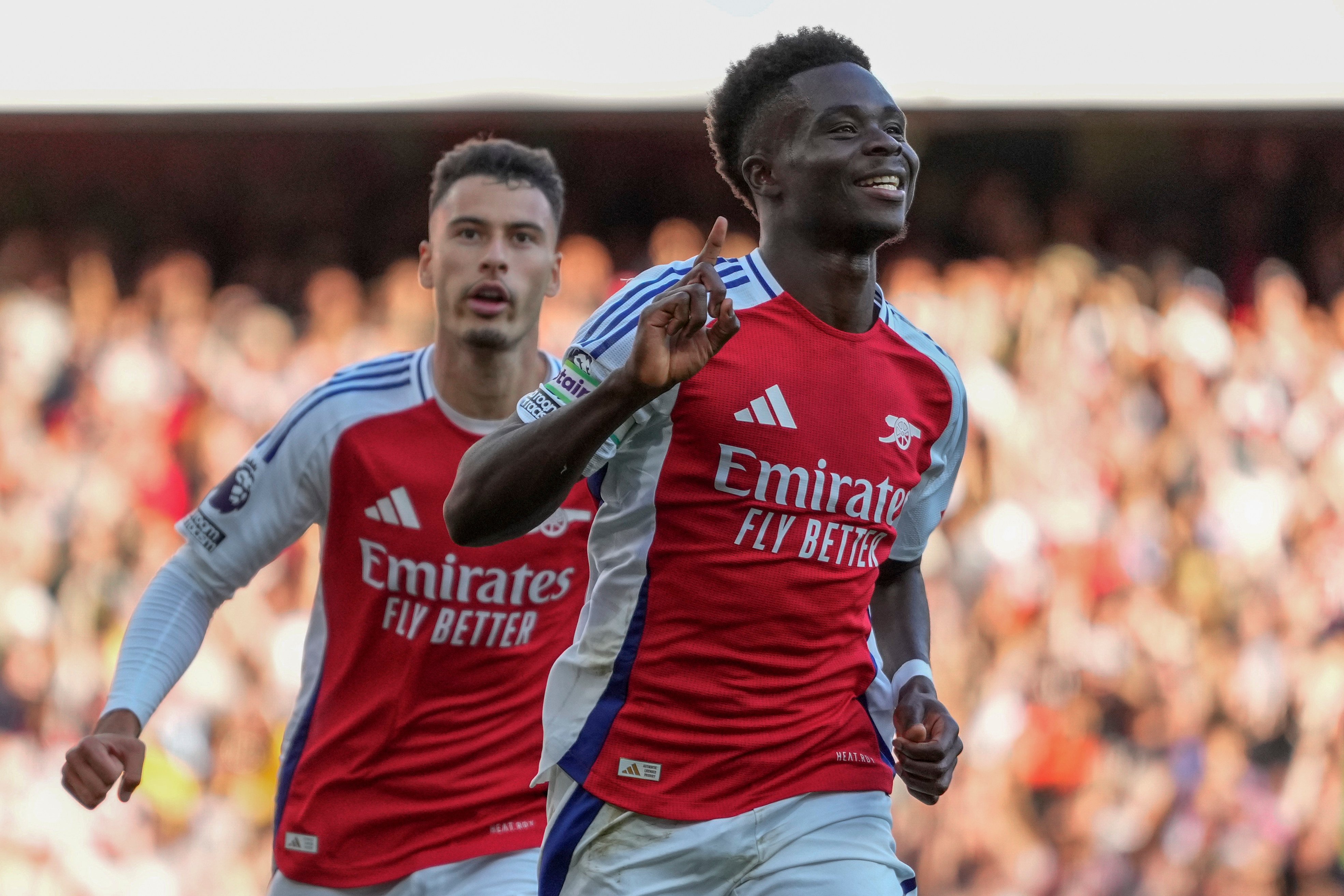 Arsenal’s Bukayo Saka celebrates after scoring the third goal against Southampton to continue their unbeaten start to the campaign. Photo: AP