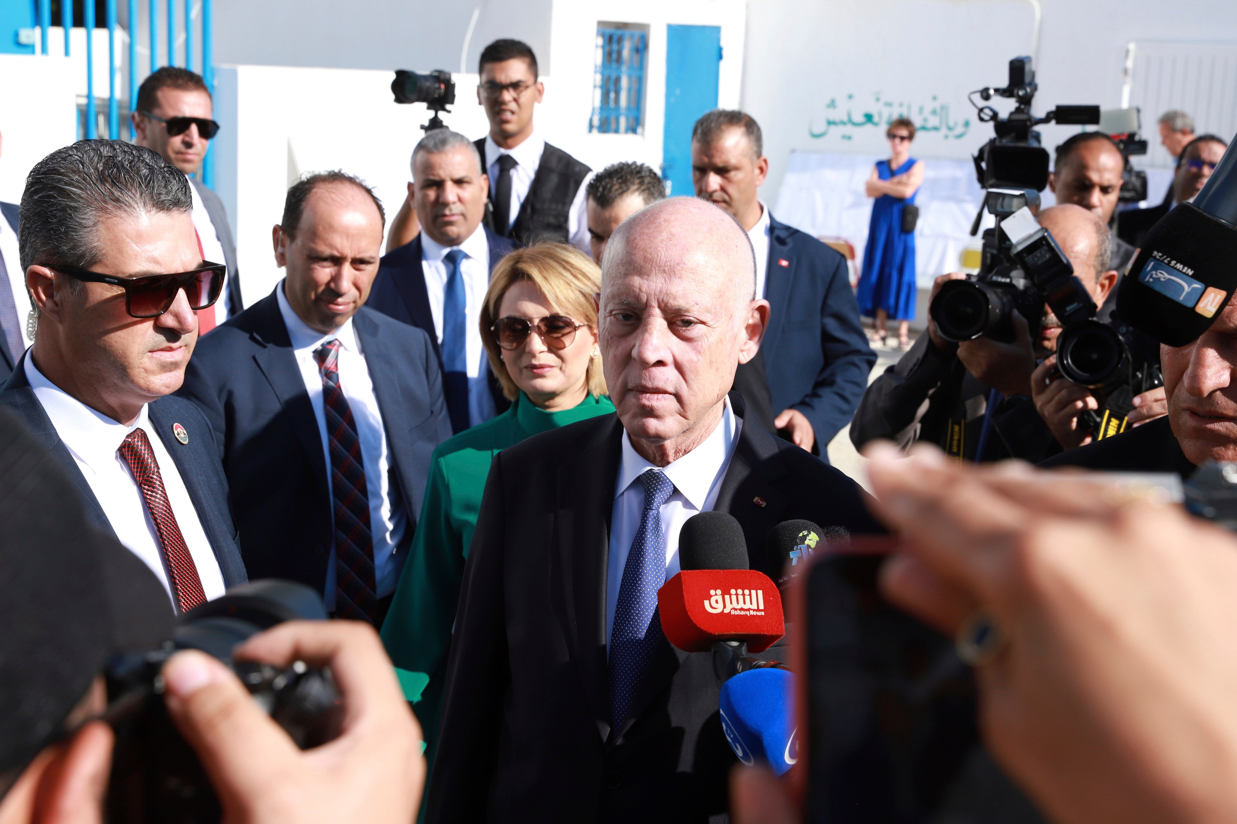 Tunisian President and candidate for re-election Kais Saied, center, and his wife Ichraf Chebil Saïed, leave a polling station after casting their votes, in Tunis, Tunisia, on Sunday. Photo: AP