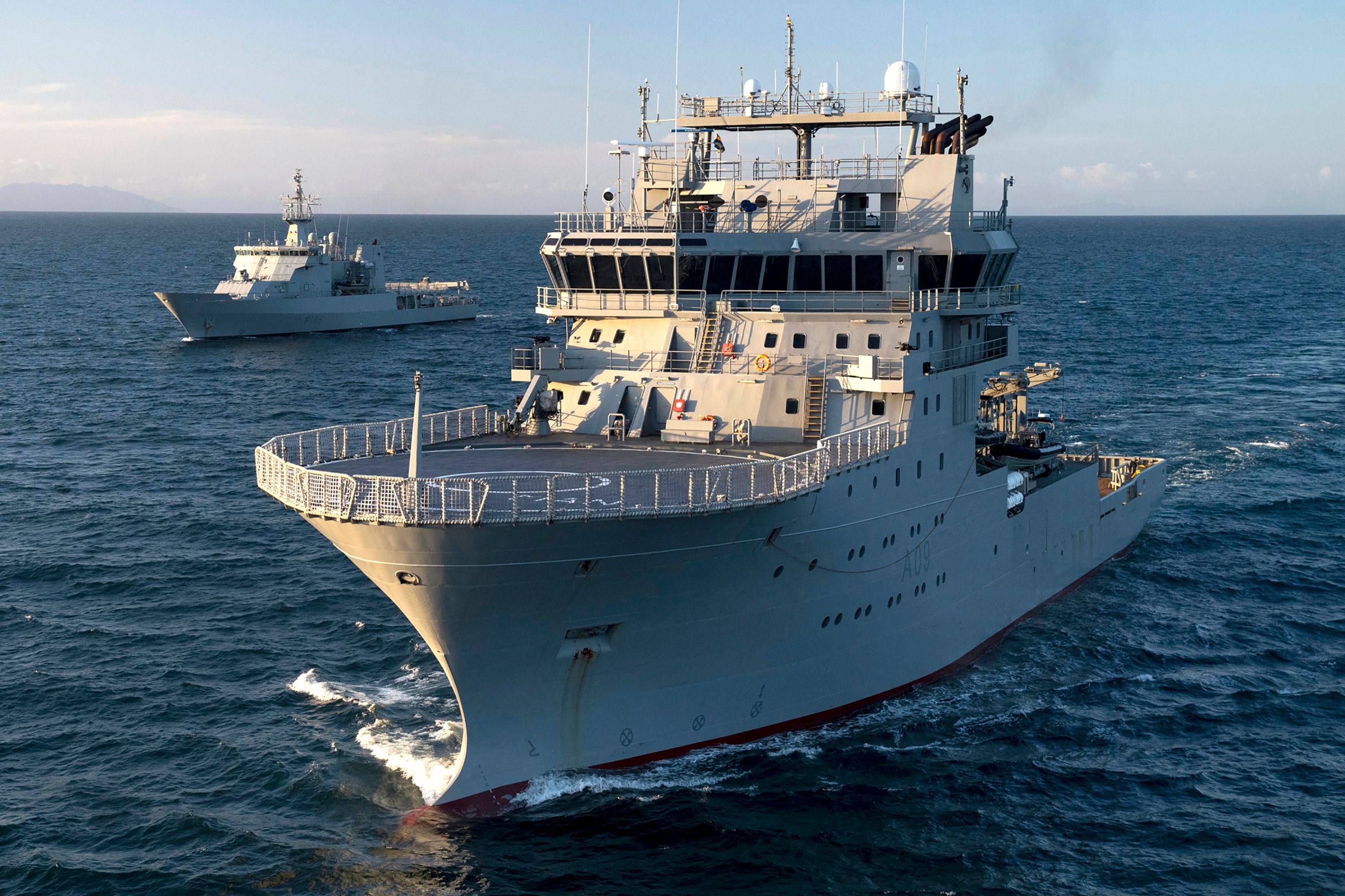 A handout photo from the New Zealand Defence Force shows the Royal New Zealand Navy ship the HMNZS Manawanui (right) in front of HMNZS Otago during a training exercise. File photo: AFP